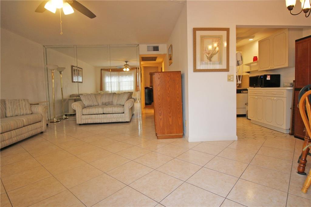 ARE YOU LOOKING FOR A 2 BEDROOM, 1.5 BATH TO MAKE YOUR OWN!! THIS 1ST FLOOR UNIT IS NOT ONLY CLEAN AND BRIGHT, BUT ALREADY HAS CERAMIC TILE ON THE DIAGONAL, NO POPCORN CEILINGS IN LIVING AREA AND KITCHEN (NO DOME HERE!!) AND A SHOWERSTALL IN THE PRIMARY BATHROOM!!  THE PATIO HAS AN EXIT DOOR TO A LOVELY GARDEN VIEW, AN EXTRA CLOSET AND HURRICANE ROLL UP SHUTTERS!! THERE IS EVEN A HURRICANE PANEL FOR THE FRONT DOOR!! AND THEN THERE ARE THE GREAT AMENITIES IN CENTURY VILLAGE EAST!! THIS 55+ COMMUNITY IS GATED WITH FREE TRANSPORTATION INSIDE AND OUT!! THE FABULOUS CLUBHOUSE FEATURES A STATE OF THE ART GYM, 1,500 SEAT THEATER, CLASSES, CLUBS, GAME ROOMS AND SO MUCH MORE!! JUST TEN MINUTES TO THE OCEAN, CLOSE TO MAJOR HWYS, SHOPPING AND RESTAURANTS! YOU WILL LOVE LIVING HERE!! ASSOC. CLAIMS 55+