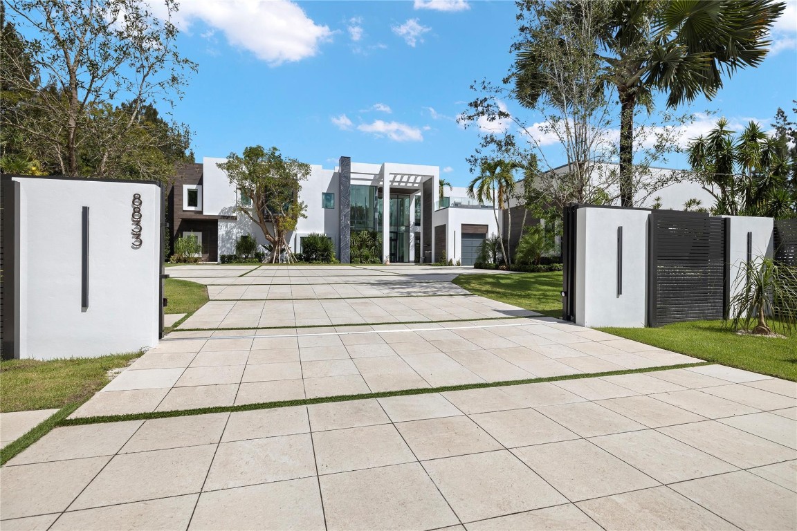 Seasonal Incentive Price drop - Limited Time - Welcome to a True Masterpiece in the city of Parkland. Set on 3+ acres of lush grounds, this property blends Luxury, Wellness, Privacy, and Nature. This architectural marvel is 11,716 Sq. Ft. with 7 Bdrm 6.5 baths, designed for sophisticated living. Every detail reflects elegance and seamless flow between indoor comfort and outdoor beauty. This resort-style outdoor oasis features a state-of-the-art pool, waterfalls, Jacuzzi, cold plunge, and outdoor kitchen—ideal for entertaining. Surrounded by tropical gardens, it offers a serene retreat. A true showpiece, this estate featured on ESPN-Hard Rock commercials-a testament to its uniqueness.  A mic-drop property where luxury, lifestyle, and nature unite. Seasonal Incentive Price drop - Limited Time- Welcome to a True Masterpiece-an extraordinary estate in the exclusive City of Parkland. Set on over 3 acres of lush, private grounds, this property perfectly blends Luxury, Wellness, Privacy and Nature. This architectural marvel expands 11716 Sq. Ft. and features 6+ bedrooms and 6.5 bathrooms, designed for sophisticated living, relaxation and entertainment. Every detail reflects elegance and flow between indoor comfort and outdoor beauty. The resort-style outdoor oasis features estate-of-the-art pool, waterfalls, Jacuzzi, cold plunge, and full outdoor kitchen, ideal for entertaining. Surrounded by tropical garden, offering a serene and secluded retreat. a True Show Piece, this estate has been featured on ESPN and Hard-Rock Commercials a Testament to its uniqueness and appeal. Opportunity like this are unmatched in the broward/Palm Beach market. This property is show-dash stopping mic drop-where luxury, lifestyle, in nature unite.