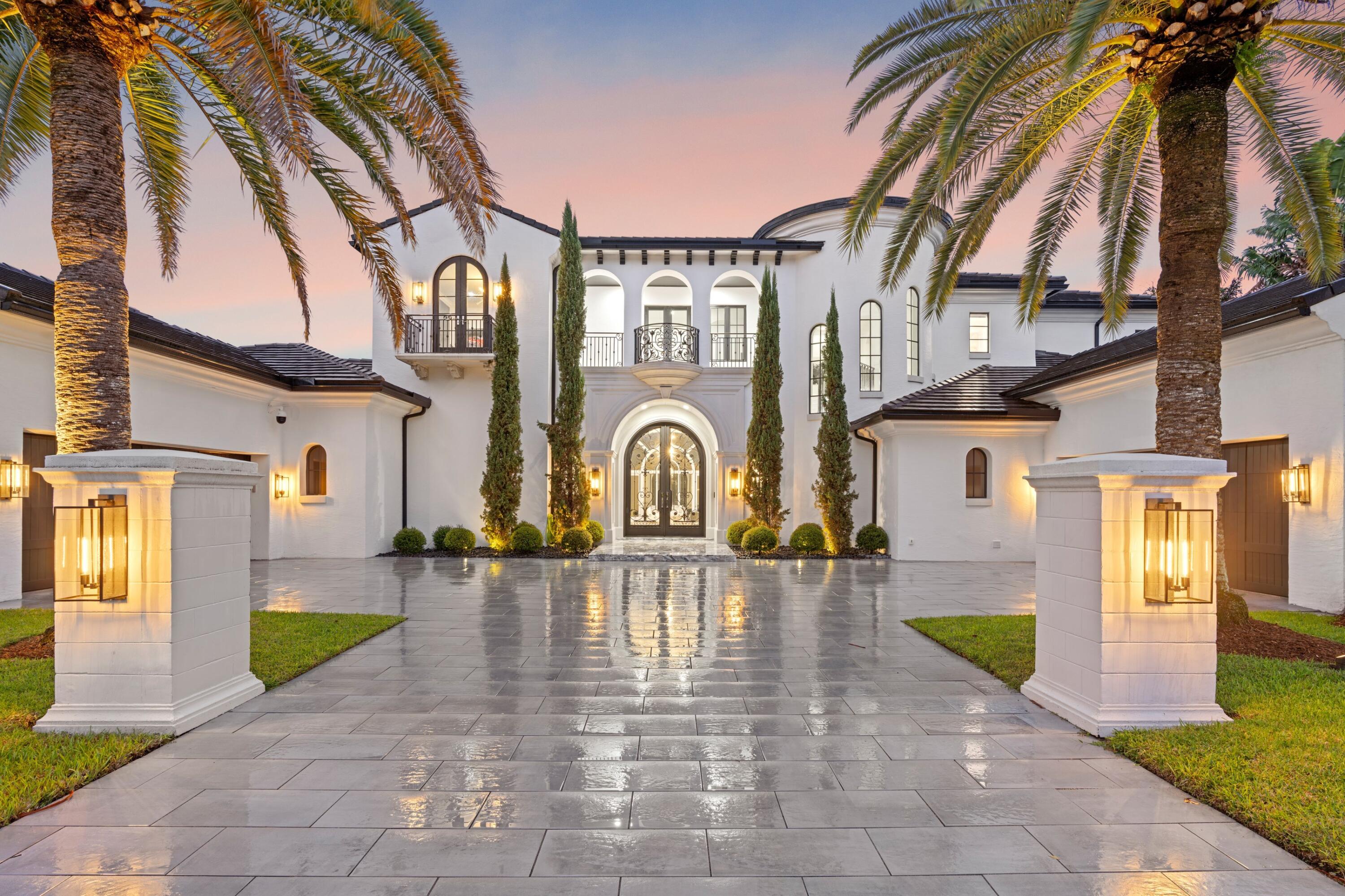 Situated on nearly half an acre with sweeping preserve and golf views, this is one of the most outstanding and refined homes to ever list in the prestigious Country Club of Mirasol. Completely redone to the highest architectural standards, it features five en-suite, oversized bedrooms and 7 bathrooms. Kitchen area was thoughtfully expanded, and includes a custom-designed Downsview kitchen which is outfitted with Miele, Wolf and SubZero appliances. Grand entrance and living area were opened up and floors are all marble or white oak arranged in a subtle herringbone pattern. Every bathroom was customized with highest grade materials (such as marble and quartzite), including his/her bathroom suites. Primary closets are Architectural Digest-worthy! Home features new roof (2021) and gutters, CCTV security, private and expansive office with large window, sound-proof entertaining room, safe room, mud room, 4 car epoxied garage (with room for a lift), 4 new AC units and more. Extra storage designed throughout, including a chef's pantry and mud room. The home is set back to allow for plenty of parking and entrance features 3cm porcelain pavers and marble landing. Backyard was professionally redesigned for an elegant, minimalistic look with low-maintence, high-grade turf surrounding the infinity pool. All impact windows and doors. Mirasol is a private, gated community with 24-hour manned security, award-winning tennis, pickleball and golf (two courses). Resort pools (three), fitness center overlooking pools and golf, numerous restaurants, card room and designated kids' sports center/ club. This lavish, yet comfortable home is situated minutes from the active club facilities, yet it's also a private refuge or an incredible haven for hosting memorable gatherings.