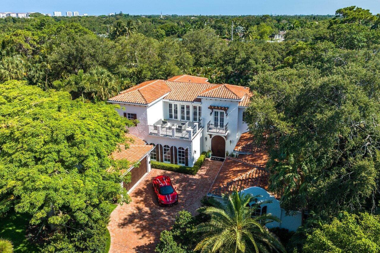 Nestled in the historic neighborhood of Old Floresta, this 2017 constructed Spanish-Colonial inspired estate boasts stunning architectural design surrounded by beautiful Pink Silk Floss trees and well-kept gardens. With 6 bedrooms and over 7,000 square feet under roof, this palatial residence offers complete privacy on sprawling grounds adorned with mature areca palms. The spacious living areas feature Italian porcelain flooring, chic chandeliers, crown molding, and volume ceilings. The high impact windows and doors allow natural light to flood the home. The gourmet kitchen features stainless steel Wolf appliances, an 11-foot island, and an airy breakfast room overlooking the lanai. The luxurious master suite, situated on the first floor for added privacy, features duel water closets... ...walk-in closets, a separate laundry room, and a bonus sitting room that could double as a home office or gym. The main level guest wing with a full bath is separate and distinct and ideal for in-law or staff quarters. Upstairs, four bedrooms (one has been converted into a theater) offer serene tree-top views, and a loft and additional laundry room complete the level. The resort-style saltwater pool and entertainment area, accompanied by a cabana bath, are framed by pecky cypress ceilings and shutters and a brick-paved drive leading to a 3-bay garage. 

Old Floresta is a historic neighborhood located in Boca Raton, Florida. It was developed in the 1920s as a planned community, and is known for its Mediterranean Revival-style architecture and lush landscaping. The neighborhood is listed on the National Register of Historic Places.

Old Floresta is situated just east of the downtown area of Boca Raton, and is bordered by Palmetto Park Road to the south, Mizner Boulevard to the east, NW 5th Avenue to the west, and NW 13th Street to the north. The neighborhood features winding streets, large trees, and beautiful homes with unique architectural features.

Many of the homes in Old Floresta were designed by noted architect Addison Mizner, who is known for his contributions to the development of Boca Raton's architectural style. The houses in Old Floresta feature stucco walls, red tile roofs, and wrought-iron details, as well as lush landscaping that gives the neighborhood a tropical feel.

Old Floresta is a highly sought-after neighborhood due to its historic charm, central location, and proximity to a variety of amenities, such as the Boca Raton Resort & Club, Mizner Park, and the beaches.

DISCLAIMER: Information published or otherwise provided by the listing company and its representatives including but not limited to prices, measurements, square footages, lot sizes, calculations, statistics, and videos are deemed reliable but are not guaranteed and are subject to errors, omissions or changes without notice. All such information should be independently verified by any prospective purchaser or seller. Parties should perform their own due diligence to verify such information prior to a sale or listing. Listing company expressly disclaims any warranty or representation regarding such information.