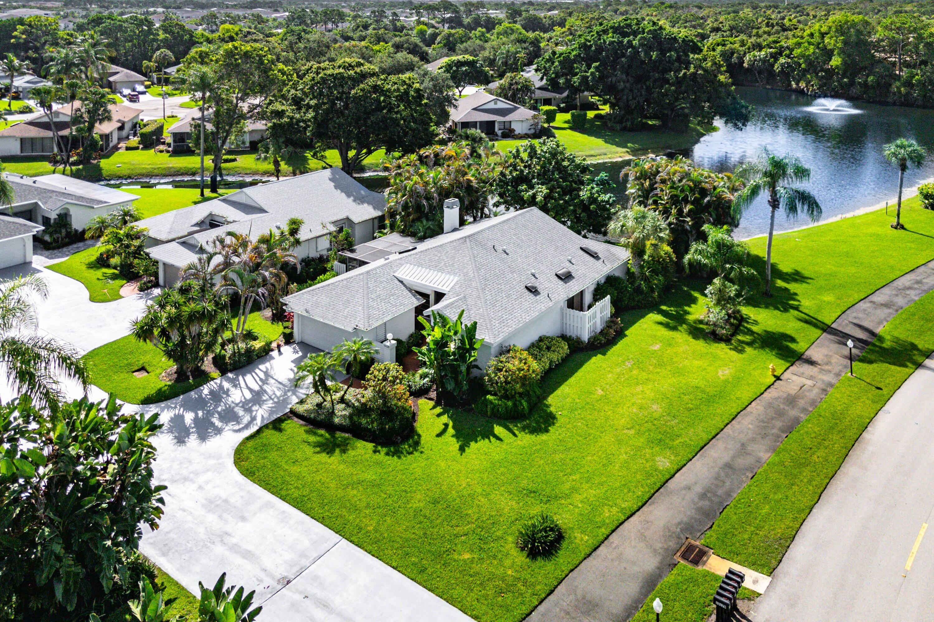Experience the very best of waterfront living in this exceptional 3-bedroom, 2-bathroom residence nestled within the prestigious gates of Eastpointe Country Club. Perfectly positioned on one of the community's most picturesque waterfront homesites, this home offers breathtaking water views from nearly every room, creating a tranquil backdrop for everyday living. Enjoy the beauty of nature right from your backyard, where herons, egrets, ducks, turtles, and other native Florida wildlife are frequent visitors, adding to the peaceful ambiance.  Designed with both comfort and entertaining in mind, the spacious open-concept floor plan is enhanced by upgraded flooring, elegant custom millwork, and abundant natural light. At the heart of the home, the oversized kitchen offers generous workspace... ample cabinetry, and seamless flow into the living and dining areas—all while overlooking the sparkling water.  A decorative fireplace adds warmth and sophistication to the main living space, while the stunning side courtyard evokes the charm of an Italian villa, creating the perfect setting for morning coffee, alfresco dining, or evening cocktails beneath the stars.  The spacious primary suite is a peaceful retreat, while two additional bedrooms provide flexibility for guests or a home office. A 1½-car garage offers additional storage for your golf cart, bicycles, or hobby space.  The seller is also open to including select furnishings, offering the opportunity to move right in and begin enjoying the Florida lifestyle.  Located within the highly sought-after Eastpointe Country Club, residents enjoy two championship golf courses, the newly completed Pointe Lifestyle Complex featuring resort-style pools, state-of-the-art fitness center, multiple dining venues, tennis, pickleball, and an active social calendar—all within a secure, 24-hour manned gated community.  This is a rare opportunity to own an absolute waterfront gem where elegant finishes, abundant wildlife, serene water views, and resort-style amenities combine to create one of Eastpointe's most desirable​​‌​​​​‌​‌​​​‌‌​​​‌‌‌​​‌​​‌‌​​​​ homes.