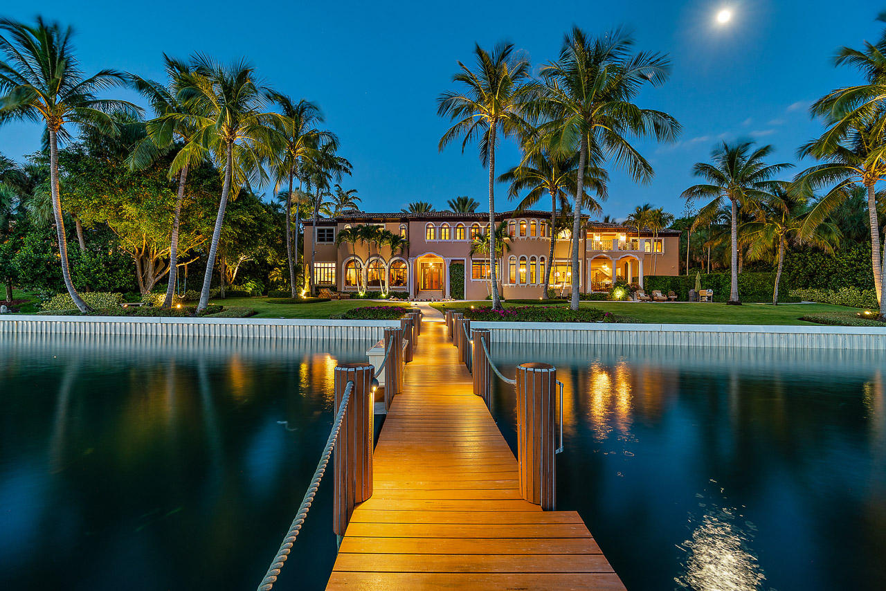 Located on the south end of Jupiter Island, this magnificent and meticulously maintained property offers convenient and quick access to the south bridge. 480 S Beach Road sits on 200' of direct Intracoastal and features wide water views and more than 7600 sq ft of living space. The house was updated in 2011 and includes 6 bedrooms, 8 full bathrooms, 2 half baths, wine cellar, summer kitchen, a guest house, deeded beach access, impact windows and doors and much much more. Surrounded by beautiful lush tropical landscaping. Deep water dockage over 8' and minutes to Jupiter Inlet with no fixed bridges.