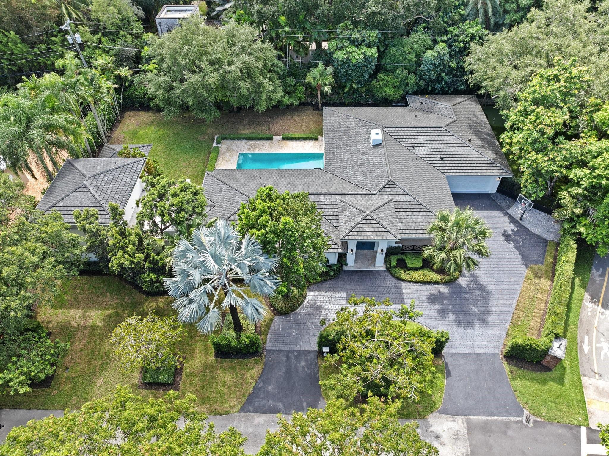 5 bedroom, 4.5 bathroom home in the heart of Coral Gables. Situated on a sprawling 17,797 sq/ft lot, this home boasts 4,200 sq/ft of living area. Large primary bedroom with a second story office or gym. Step outside to your own private oasis, complete with a sparkling pool, inviting cabana, and a children's playground. Lush landscaping and expansive lawn create a serene and tranquil environment. Enjoy the balance of privacy and convenience, with easy access to Coral Gables' top-rated schools, upscale shopping, and world-class dining. SEE BROKER REMARKS.