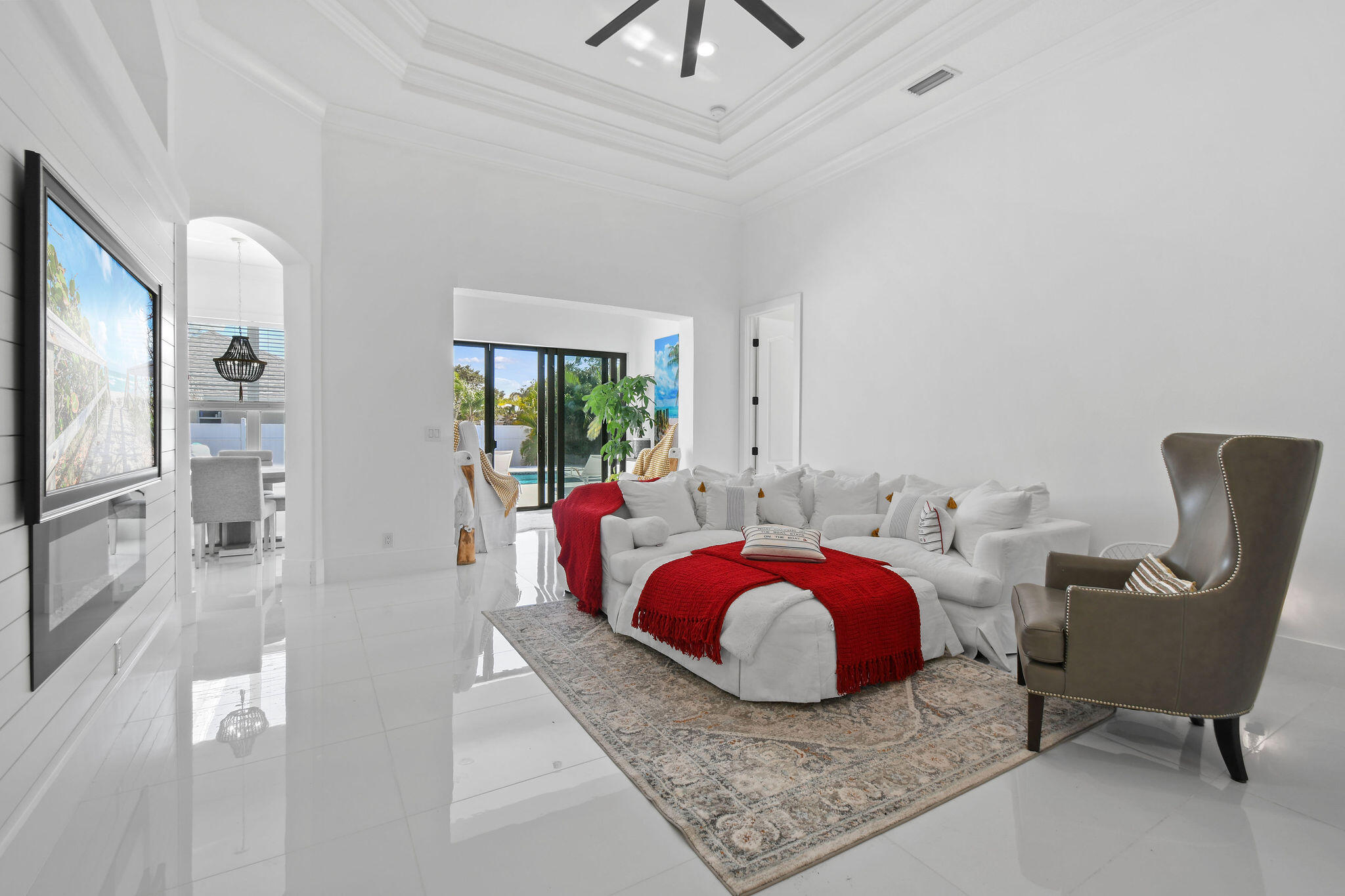 This beautifully updated 4 BR / 2 BA/ 3,085-LSF home perfectly blends elegance, comfort & functionality. Each detail feels intentional - from the luxurious primary retreat to the open-concept kitchen flows effortlessly into multiple living areas. The cohesive design continues outdoors with 2172 SF of sparkling resort-style pool, travertine paver decking, and a tiki retreat - creating a harmonious extension of living space ideal for entertaining & relaxation. This versatile floor plan includes formal living & dining rooms, den, and Florida room spacious, inviting, and designed for everyday living. Other features include Calacatta-style quartz waterfall island, coffered ceilings, crown molding, sleek porcelain tile throughout & so much more!! Beautiful Pool Home & NO HOA!!   The sellers are highly motivated and open to negotiation. This updated residence features 4 bedrooms, 2 bathrooms, formal living and dining rooms, a spacious family room, casual dining area, and a large eat-at snack bar accommodating six. The private den/office is adjacent to the primary suite, and the enclosed Florida room offers additional living space. The finished area under air totals 3,085 square feet (which includes the 240sf former enclosed patio), with a total property size of 3,198 square feet. Parking includes a two-car garage, a four-car driveway.  Outdoor Amenities: Enjoy a resort-style, salt chlorinated Pool (14' x 25'.5") accompanied by a travertine deck spanning 2,172 square feet, and a dedicated tiki retreat - prewired and plumbed for an outdoor kitchen.  Gross outdoor area encompasses 5,370 square feet on a 0.25-acre lot (10,490 sf)  Risk Mitigation and Due Diligence: Storm protection measures include impact-resistant garage doors, sliding doors, and a transom window in the den/office, with panels installed on all other openings.  Comprehensive inspections general property, 4-point, and wind mitigation have been recently completed and are available for review, supporting informed investment decisions.  Investment Opportunity: With no HOA restrictions and a resort-style pool complemented by an expansive outdoor living area beneath a tiki hut, this property presents a compelling opportunity for investors seeking a turnkey asset featuring substantial amenities and recent upgrades. The offering is well-suited for corporate ownership, 1031 Exchange, or similar investment strategies.  See Documents with complete updates