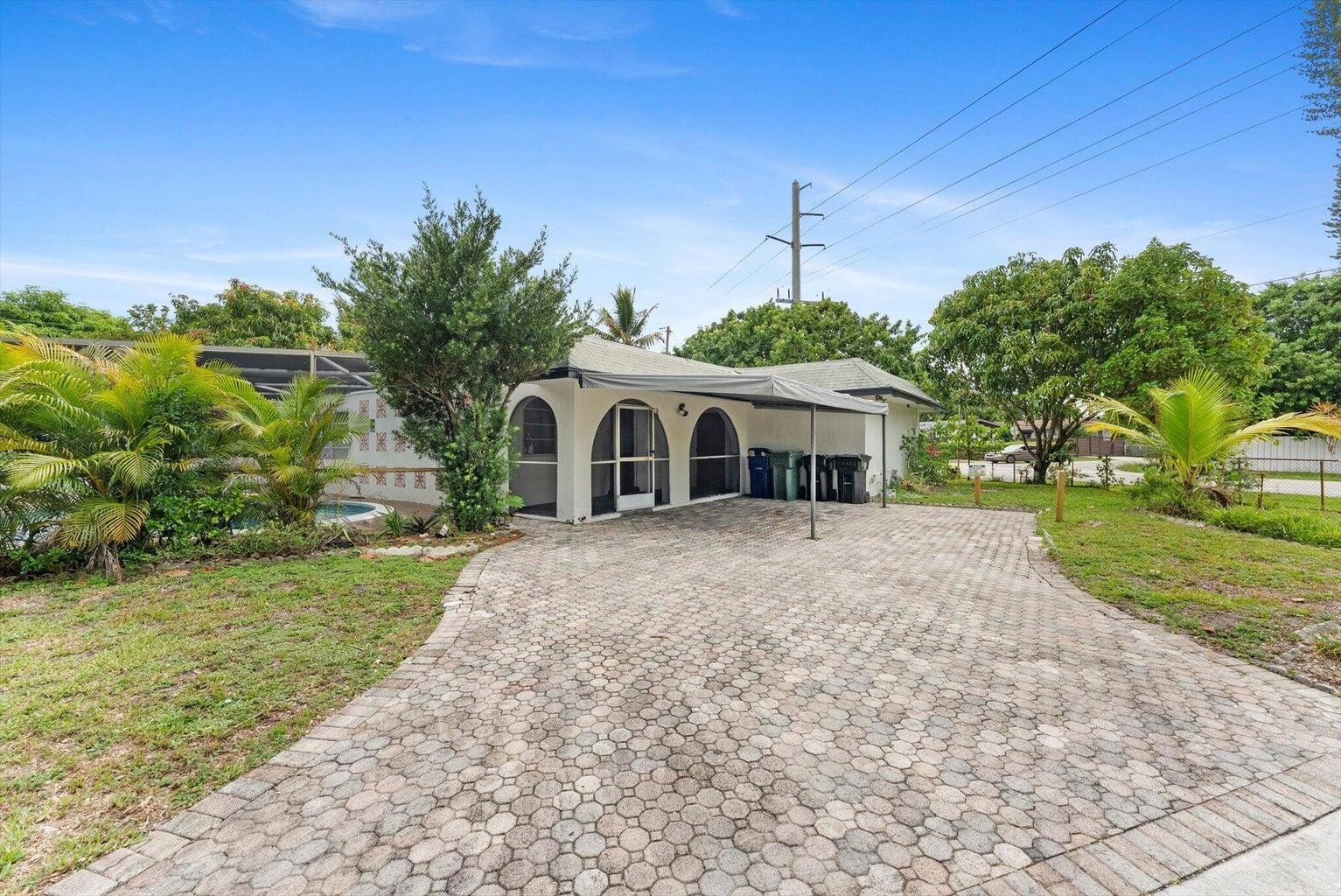 Beautifully remodeled centrally located 4/2 Pool home on a huge corner lot! Extremely spacious open layout, private and serene surrounded by foliage making a wonderful outdoor oasis. Completely screened in pool area, Plenty of parking, fully fenced, with additional outdoor laundry room
