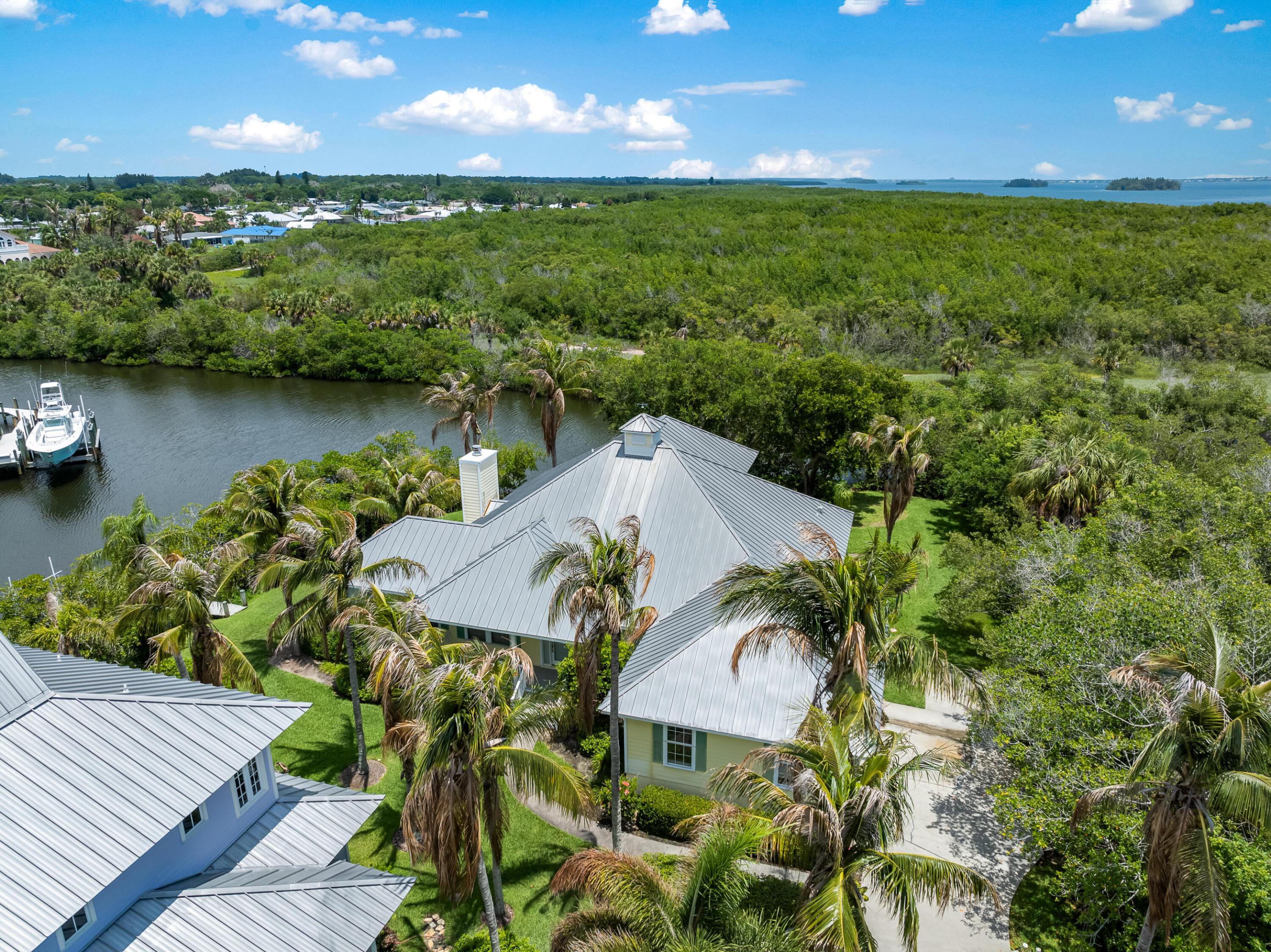 Boater's paradise! Rare corner-lot waterfront home with over 200 feet of canal frontage and one of the quickest access to the Indian River, Intracoastal Waterway, and Atlantic Ocean. As the last home on the canal, you'll enjoy panoramic water views. This spacious 3BR/3BA residence offers 2,727 SF, and a large screened porch overlooking the canal. Recently repiped and ready for your personal touches, this is a unique opportunity to own an exceptional waterfront property with abundant dockage potential and outstanding boating access.