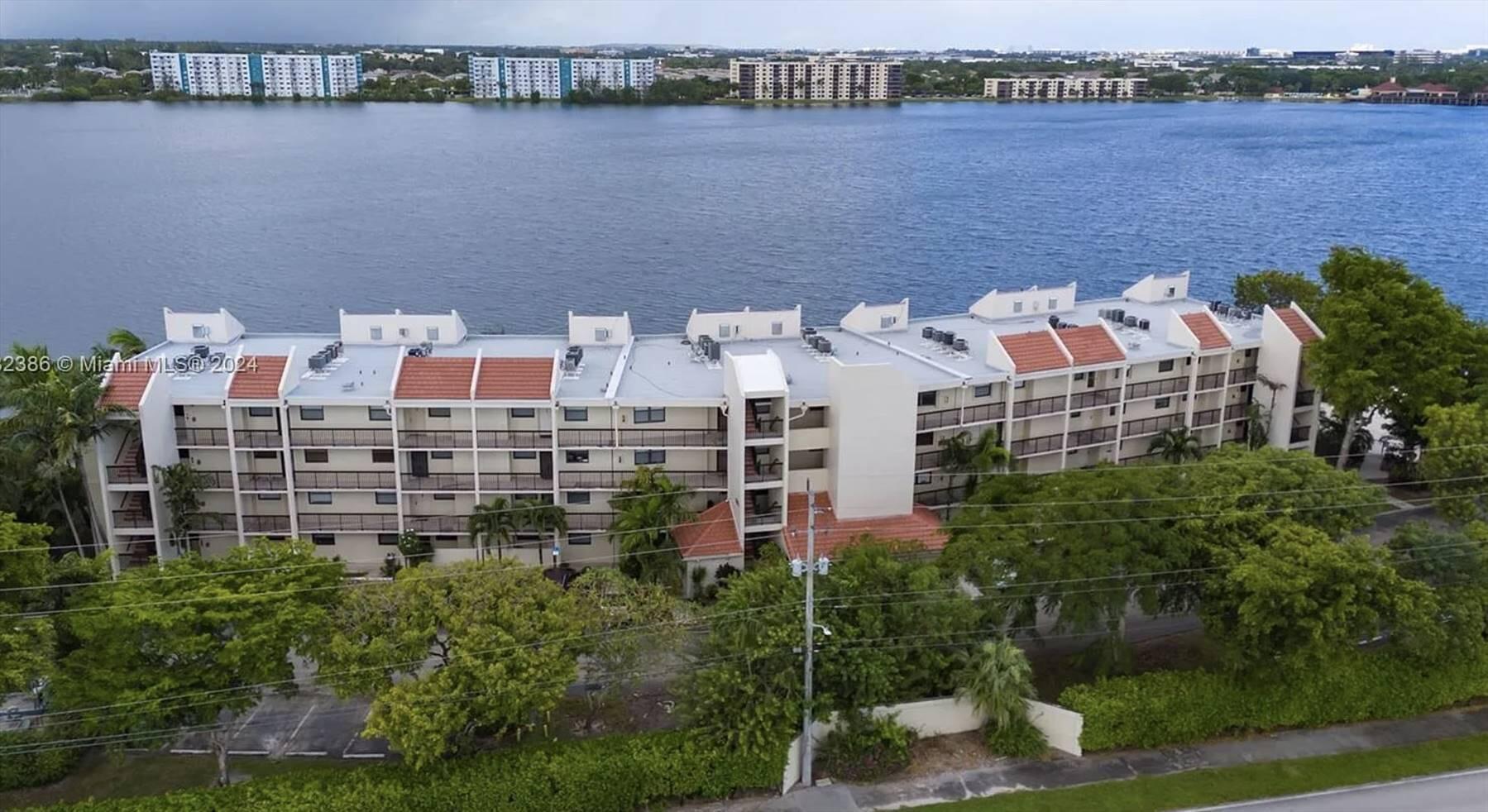 Some photos have been virtually staged. Bright, updated 2/2 condo with stunning views of a 168-acre lake in secure, 24/7 guard-gated Lake Emerald. Modern kitchen features white shaker cabinets, quartz countertops, and stainless steel appliances. New vinyl flooring, fresh paint, and refreshed bathrooms with new vanities and lighting throughout. Major upgrades completed, including 40-year recertification, new 2024 roof, concrete/stucco restoration, and waterproofed balconies. Remaining assessment paid by seller at closing! Enjoy resort-style amenities: 3 pools, jacuzzis, gym, tennis & basketball courts, lakeside BBQ clubhouse, kayaking, and paddleboarding. Minutes to Fort Lauderdale attractions. Turn-key, worry-free living! Owner financing available with flexible terms - no bank needed!