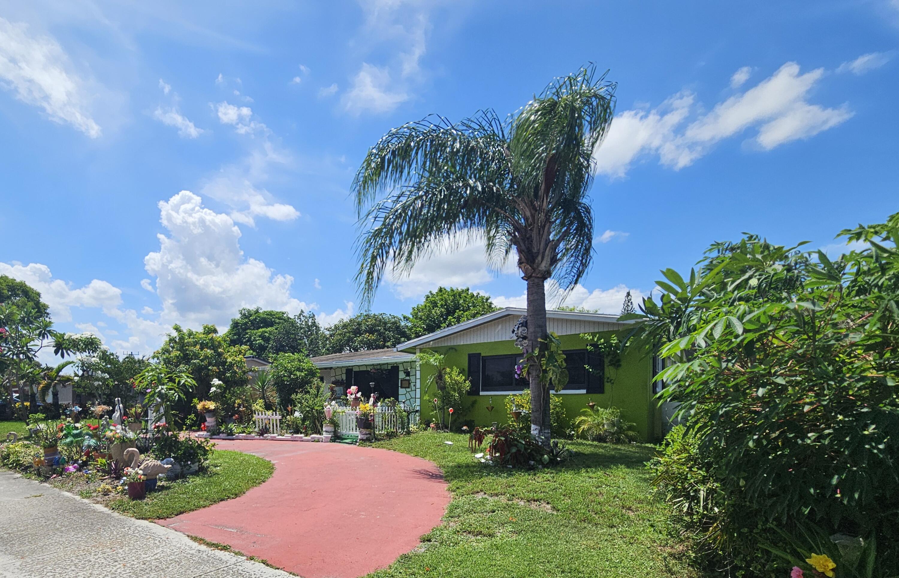 SPECTACULAR SINGLE FAMILY HOME WITH NO HOA located in the heart of West Palm Beach. 3 Bedroom, 2 Bathroom home with newer AC, Stainless Steel Refrigerator, Dishwasher and Microwave. Updated Primary Bathroom, and inside utility area. Step outside into the back Patio, sit under the Arbor and enjoy the garden with fruit trees and plants all throughout the backyard. Large circular driveway for plenty of parking. Carport has been converted into a storage area, and both Sheds will stay with property. Must see to appreciate!