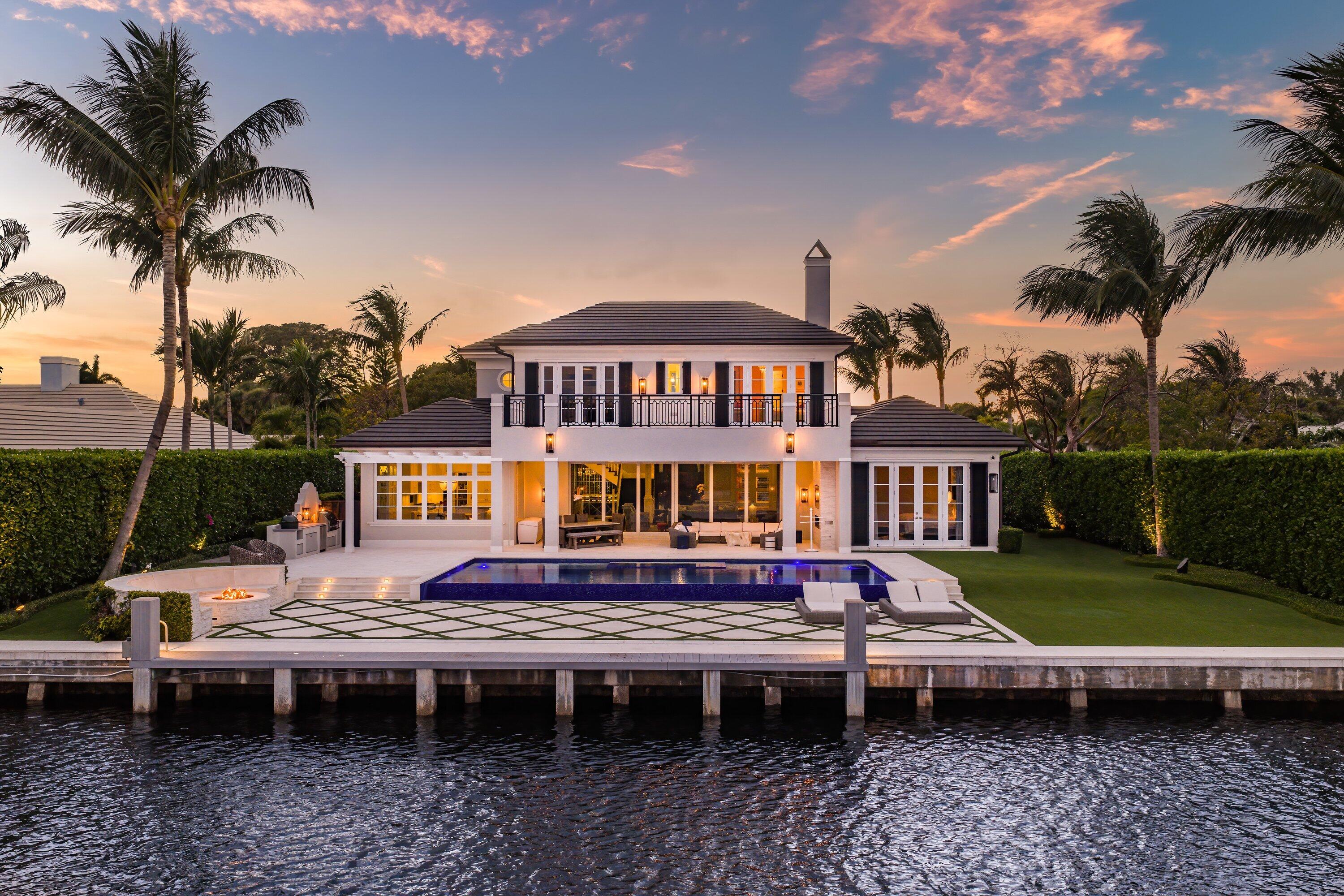 Beautifully appointed and thoughtfully designed and built in 2017 by Wietsma & Lippolis, this transitional waterfront residence is ideally situated within the coveted enclave of Au Soleil in Gulf Stream. Offering 105 feet of deepwater frontage along the Intracoastal Waterway, the property is perfectly suited for the boating enthusiast, blending refined design with effortless coastal living. The home's open-concept main living level is designed for both elevated entertaining and everyday comfort, featuring a chef's kitchen with dual oversized islands, premium Thermador appliances, and a sunlit breakfast nook. The expansive living area flows seamlessly to a resort-style pool and outdoor spaces, all framed by sweeping Intracoastal views.  Additional highlights include a whole home generator and fully integrated Crestron system with Vantage lighting system, a sophisticated wet bar, a beautifully curated wine room, and a private den or office just off the main living area. A first-floor primary suite offers a serene retreat, complete with a spacious custom-built closet, a luxurious bath, and a private outdoor shower. The residence encompasses four bedrooms, four full and one half bathrooms, a two-car garage, and an upstairs flex space adaptable to a variety of lifestyle needs. This exceptional waterfront offering combines timeless transitional style, modern construction, and an unbeatable Gulf Stream location.