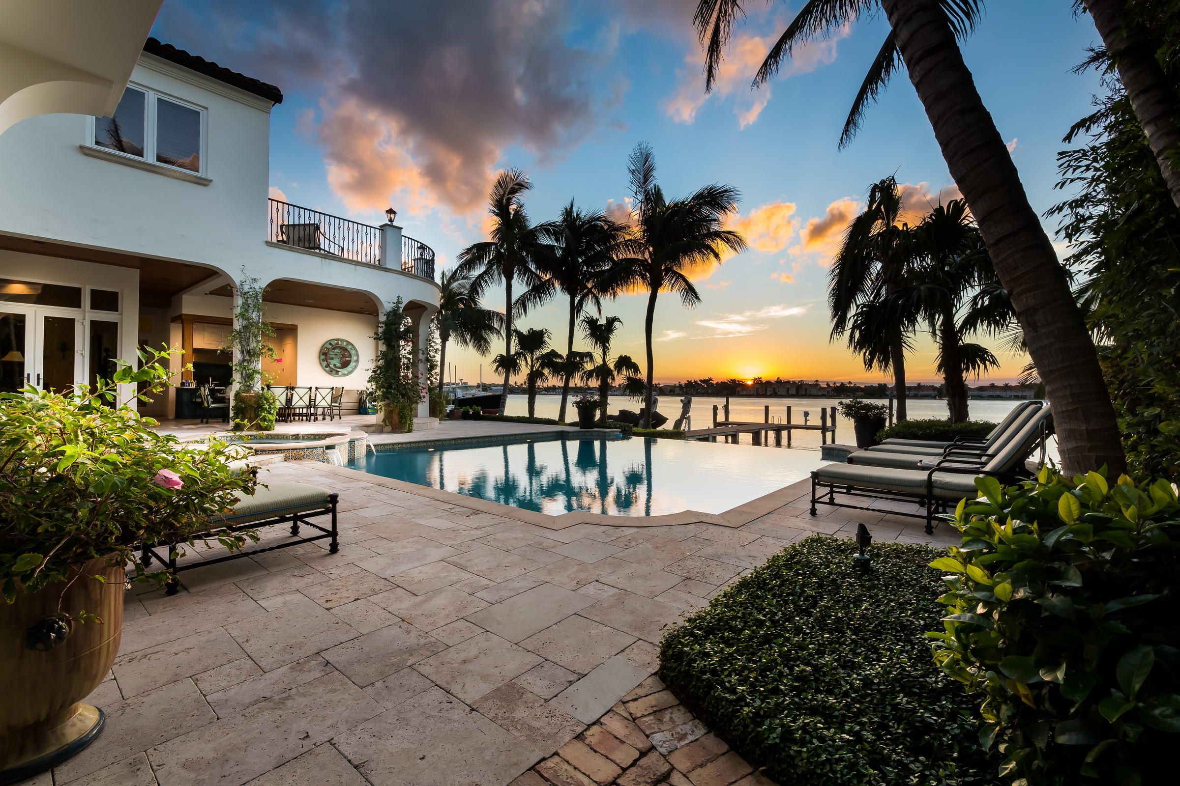 Located in prestigious Point Manalapan, this waterfront paradise provides amazing views of the Intracoastal. This stunningly designed home built in 2008 boasts six bedrooms and seven full bathrooms and one half bathroom. Enter the home through custom made French doors into a dramatic two story foyer looking into living room with fireplace and water views. To the left of the entry you will find a private formal dining room with a temperature controlled wine room. The open concept chef’s custom kitchen and family room make entertaining easy. 

Take the elevator upstairs to your enormous master suite with his and her bathrooms, large custom closets, sitting area and large balcony peering over the pool and Intracoastal. An office connects to the master with an additional separate entrance. Located in prestigious Point Manalapan, this waterfront paradise provides amazing views of the Intracoastal. This stunningly designed home built in 2008 boasts six bedrooms and seven full bathrooms and one half bathroom. Enter the home through custom made French doors into a dramatic two story foyer looking into living room with fireplace and water views. To the left of the entry you will find a private formal dining room with a temperature controlled wine room. The open concept chef's custom kitchen and family room make entertaining easy. 

Take the elevator upstairs to your enormous master suite with his and her bathrooms, large custom closets, sitting area and large balcony peering over the pool and Intracoastal. An office connects to the master with an additional separate entrance.  The upstairs also contains three additional large bedrooms with en-suite bathrooms and a second laundry room.

Travel back downstairs to find two additional guest suites and a game room. 

Experience waterfront living at its finest with unobstructed panoramic views of the Intracoastal, a dock ready for a large boat, spacious covered patio with summer kitchen and dining area. Enjoy the sunsets from your backyard!