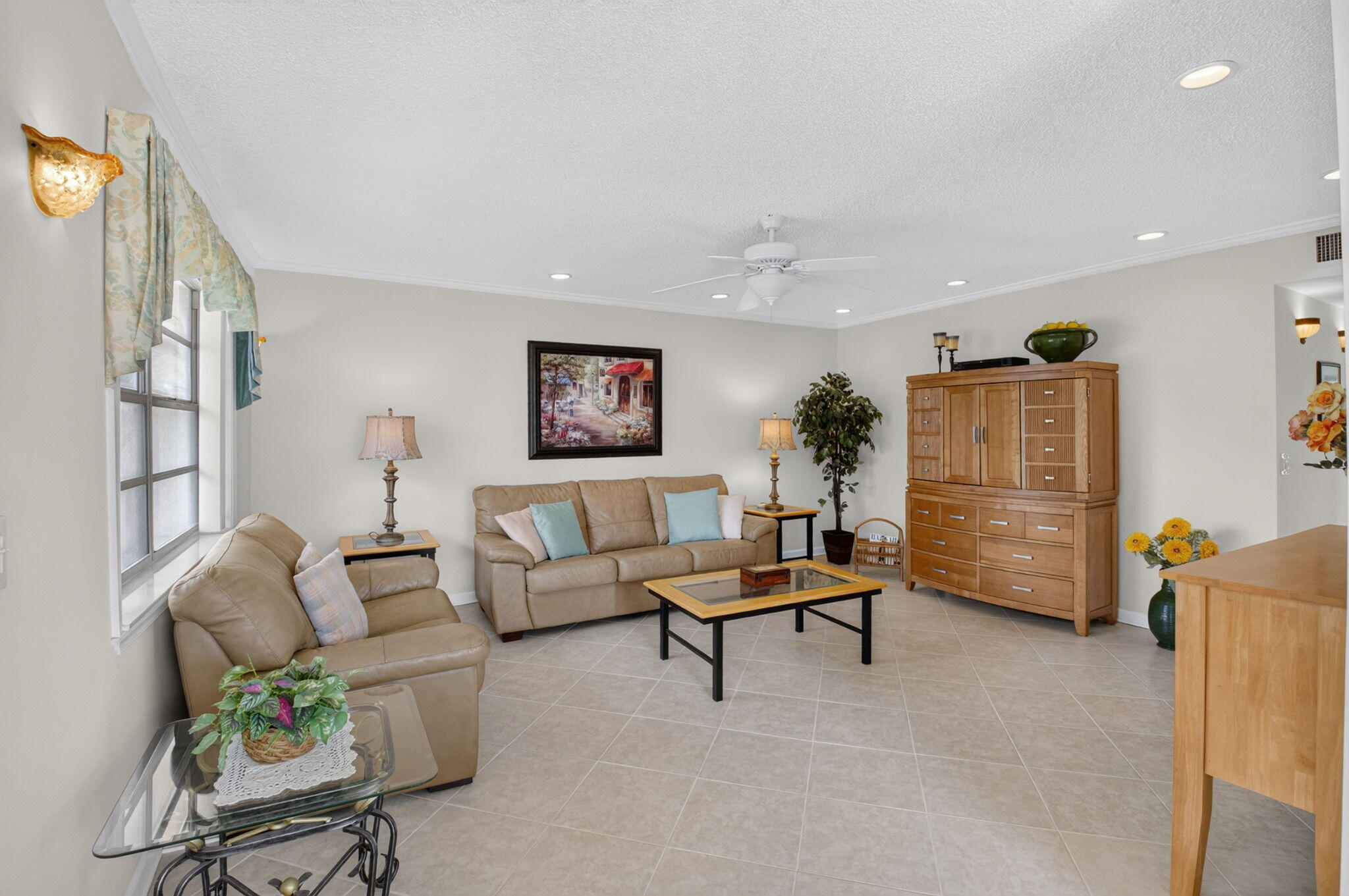 CORNER UNIT, thoughtfully renovated & truly one of a kind,  in Kings Point! Stunning 2-bedroom, 2-bath condo has been thoughtfully renovated with no detail overlooked. Closets, closets, closets! Custom-added storage, including bathroom linen closet, makes this home unlike any other in the community. Natural light gleams through the condo! Enjoy breathtaking golf course and lake views from the spacious balcony, complete with oversized utility closet housing a full-size washer & dryer. The primary suite features beautiful French doors leading directly to the screened balcony. Major updates include a newer roof, A/C (2023), water heater (2025) & HOA has RESERVES! Move-in ready—just bring your suitcase and enjoy the lifestyle!