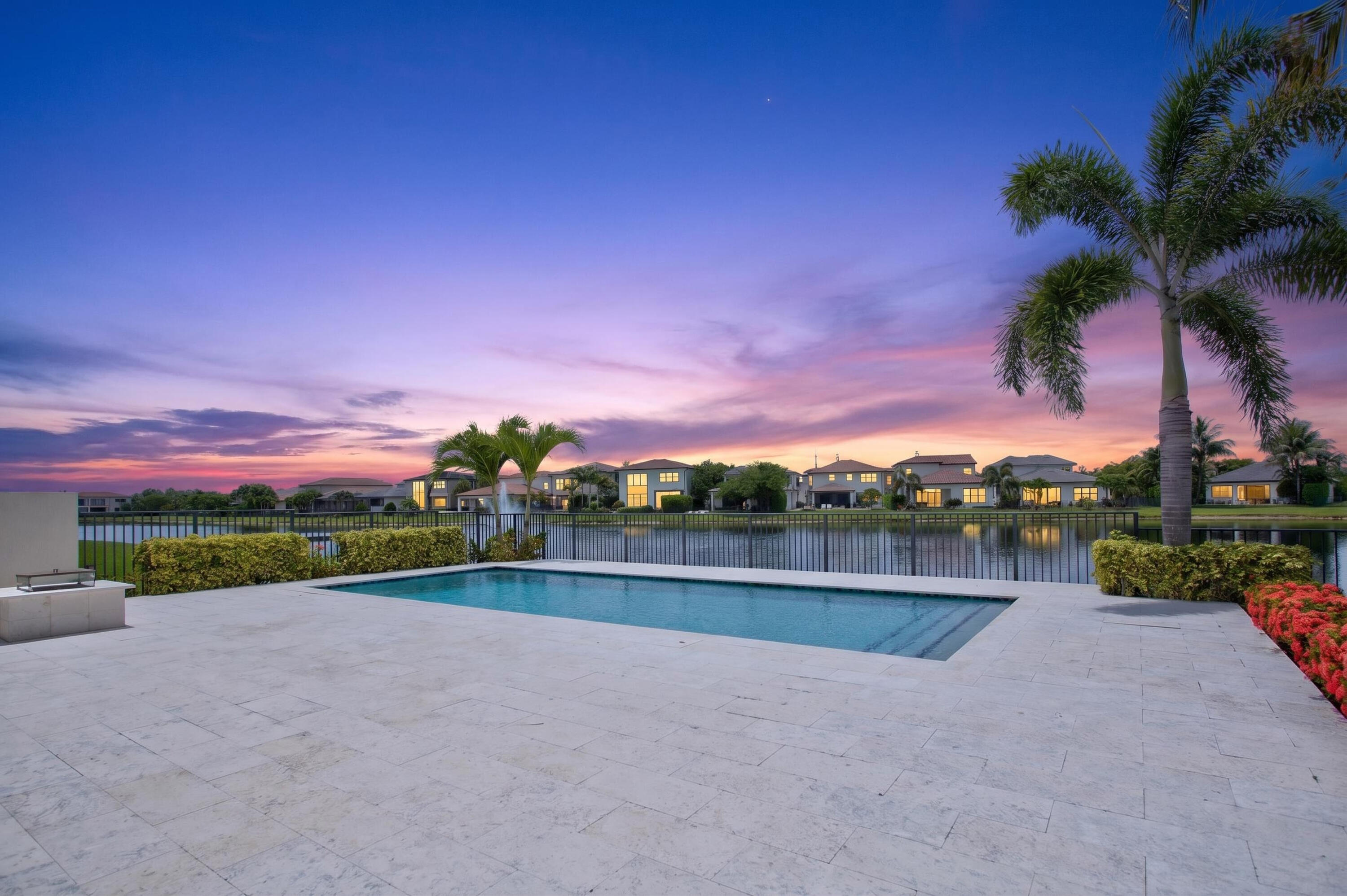 Welcome to luxury living in the prestigious, gated enclave of Palm Meadows Estates. This stunning "Provence" model features 4 spacious bedrooms plus office/den and 4.5 bathrooms, and over 3,312 square feet of beautifully designed, light-filled living space, perfectly situated on a premium corner lot with sweeping lake views.  Step out back into your own private paradise, complete with a sparkling custom pool positioned for ideal southern exposure—ensuring gorgeous, natural Florida sunshine all day long.  Natural Gas Fire-Pit for evenings with friends and family making s'mores and enjoying the Sunset.  Built with meticulous attention to detail, this CBS-construction home offers peace of mind with full hurricane-impact glass windows and solid doors.   Sellers didn't skip a detail when it came to the upgrades. A wrought iron and wood staircase with an Office Den at the entry to the property and that second, first floor bedroom and full bath allows for multigenerational living   The open-concept layout boasts soaring volume ceilings, a modern gourmet kitchen with Gas Cooking direct to the property.   This gourmet kitchen with ample space for a large family and entertaining friends that flows to the main living area and the outdoor oasis.  Also on the first-floor is the  primary bedroom suite acting as your private sanctuary.  Residents of Palm Meadows enjoy world-class resort-style amenities, Just steps from the property including a luxury clubhouse, state-of-the-art fitness center, resort pool, and sports courts, pickleball and tennis. Perfectly located in Boynton Beach with easy access to fine dining, shopping, and pristine area beaches. Schedule your private tour today!