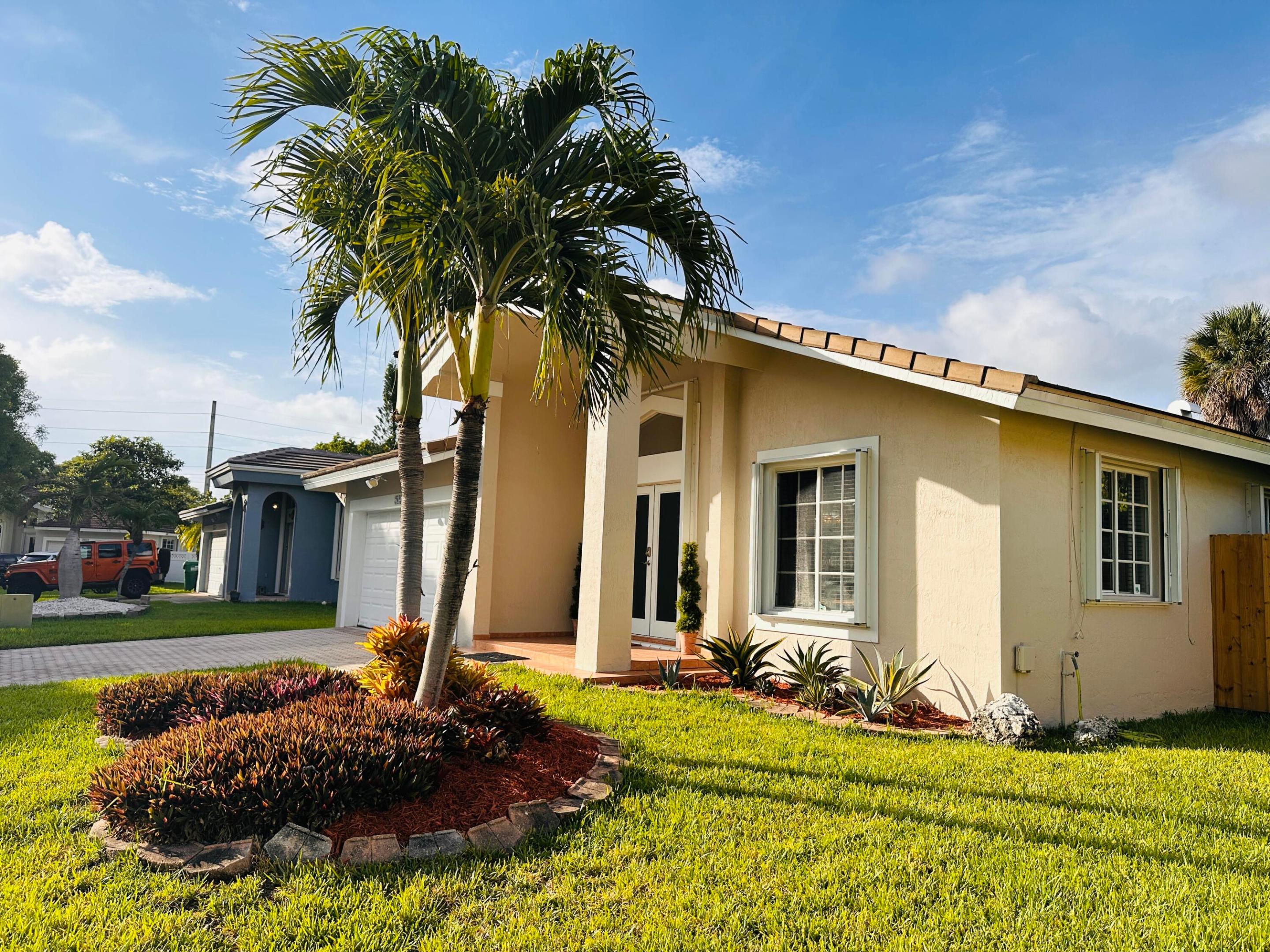 PRICED TO SELL : Stunning, fully updated 4 bedroom, 2 bath Cutler Bay beauty — priced to sell and truly move in ready. This home features a bright, open floor plan with seamless flow, complemented by a recently renovated kitchen showcasing high end appliances, modern cabinetry, and premium finishes. All bathrooms have been tastefully updated, and the home boasts new flooring throughout for a clean, contemporary feel. With spacious bedrooms, abundant natural light, and thoughtful upgrades in every corner, this property delivers comfort, style, and value with an avocado and a fruit cocktail tree which produces grapefruit, meyers lemons and 3 different oranges. A rare find in today's market, bring your belongings and start living. Homes like this turnkey don't last in Cutler Bay.  New Flat Tile Roof Replace in 2021