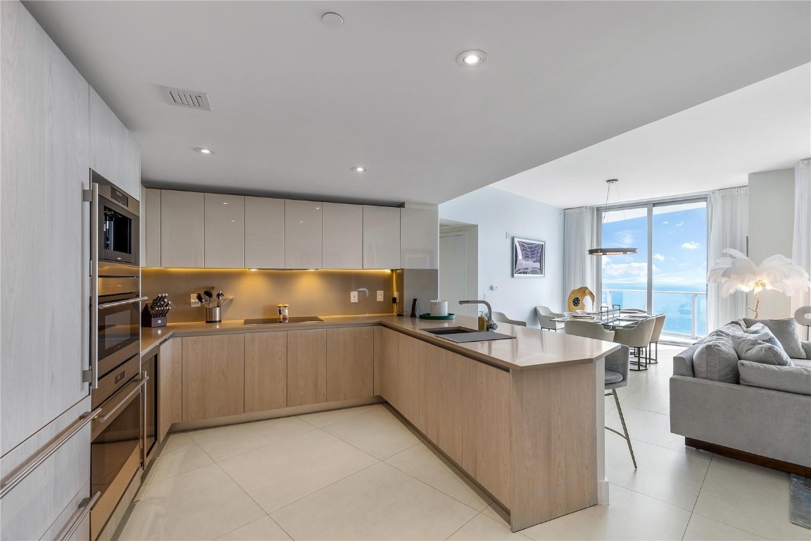 Rare opportunity to own one of the largest residences at Hyde Beach. This expansive 4BR/3.5BA corner unit offers over 2,500 sq ft of interior space—ideal for full-time living, a second home, or hosting with ease. Floor-to-ceiling glass showcases ocean and Intracoastal views, while the open layout and multiple living areas provide comfort and flexibility rarely found in the building. A unique alternative to smaller units, offering exceptional space at a compelling price per square foot. Enjoy resort-style amenities including pools, fitness center, beach service, dining, and more.