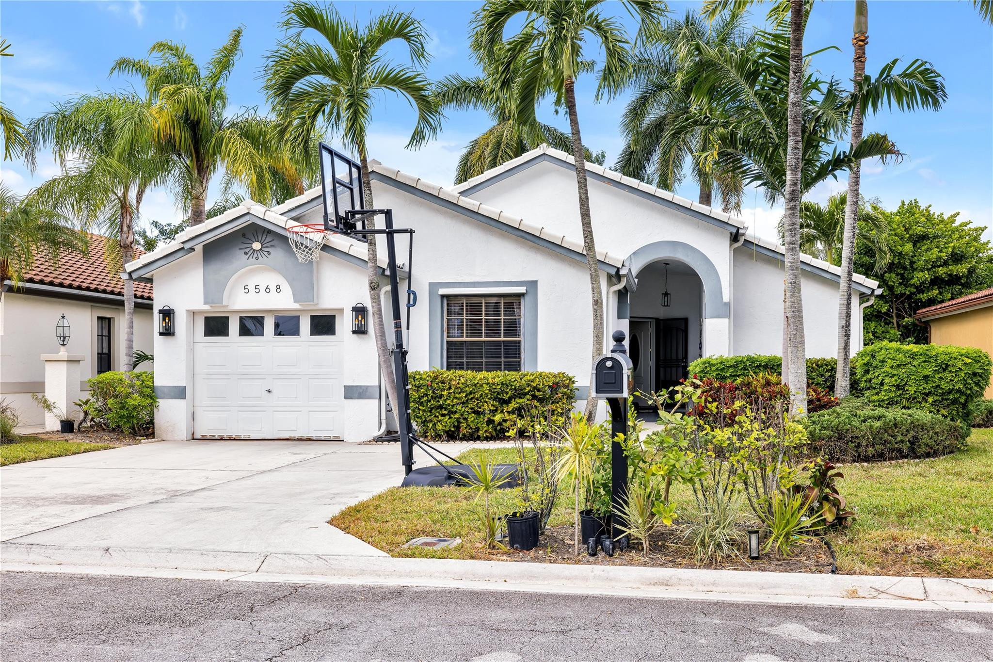 Welcome to this charming 3-bedroom, 2-bathroom waterfront residence, complete with garage and screened in lanai overlooking tranquil water views. This single-story home offers 1,367 square feet of comfortable living space, perfectly designed for those seeking a compact yet functional layout.  This home presents the rare opportunity to own in this sought after and quint American Heritage community,  located less than 5 miles from Downtown Delray and picturesque beaches. Home Features a beautifully remodeled kitchen, vaulted ceilings, updated bathrooms, waterfront views, energy rated appliances, complete hurricane panel system, & brand NEW ROOF and AC.  Must owner occupy 2 years before leasing. No overnight parking for commercial trucks, trailers, or RV's. Must be in Garage.
