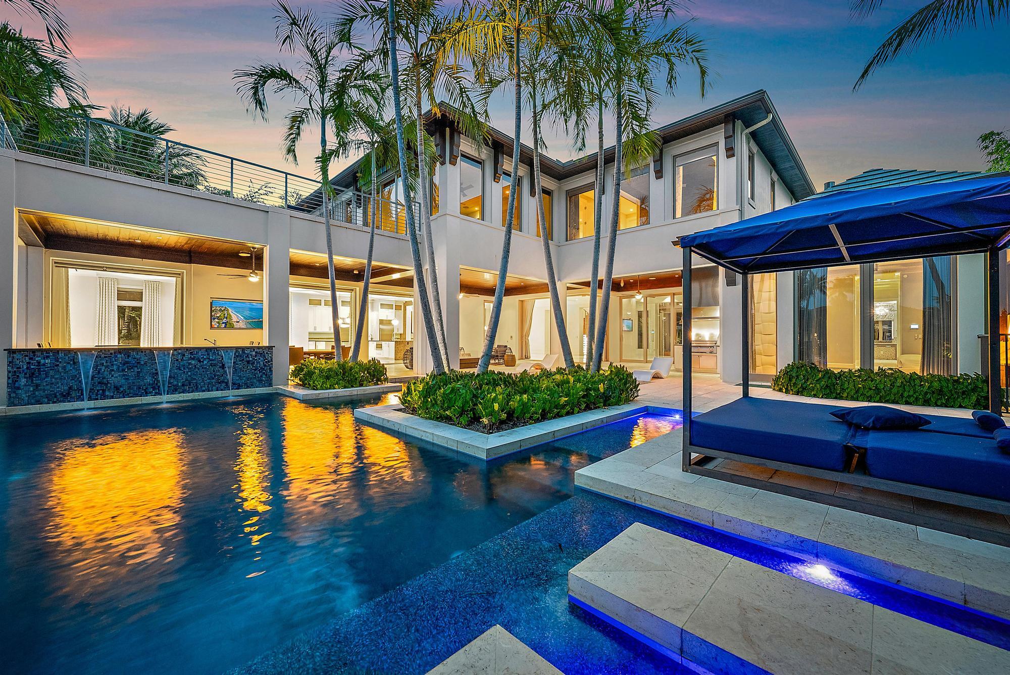 Live the ultimate waterfront lifestyle at 177 Commodore Drive. Dock your 94' yacht steps from your door, entertain effortlessly with a resort-style pool, putting green, and luxe outdoor lounges. Inside, 5 ensuite bedrooms, smart tech, designer touches, and an entertainer's kitchen define sophistication. All within Jupiter's prestigious Admirals Cove.  

Admirals Cove offers an unparalleled lifestyle with world-class amenities: 45 holes of championship golf, 9 pristine tennis courts, and pickleball courts for year-round recreation. Indulge in resort-style relaxation with a spa, pool, and fitness center, or enjoy casual dining at 4 exquisite restaurants. With a vibrant dog park, playground, and a luxurious hotel, this exclusive community is where luxury meets leisure at every turn. This property features custom drapes, motorized shades, blackout shades, drop down televisions, gas fireplaces, top tier appliances, 3 wine coolers, glass wine storage & smart home features, exterior mosquito control, cabana lounges, deck with fireplace, jet ski platform, boat lift, putting green, outdoor televisions, motorized outdoor screens,  are just a few of the amenities found at 177 Commodore Dr.  Admirals Cove presents golfers with 45 greens, 9 tennis courts, pickleball, pool, hotel, spa, fitness center, playground, large dog park that is quite the hot spot, and 4 restaurants plus a great spot for golfers out getting in the swing of things.