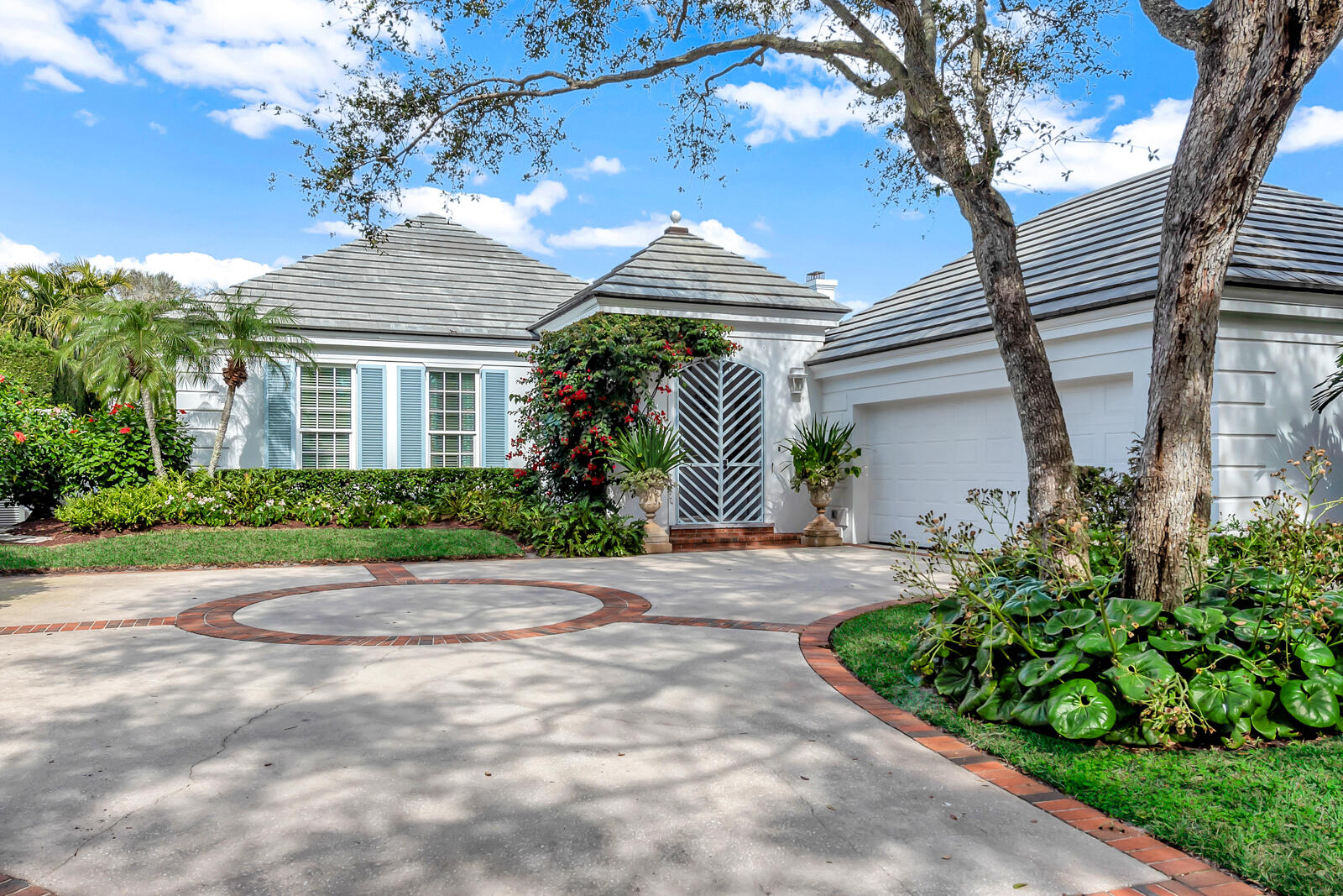 Located in the exquisite gated community of John's Island. Rarely available freshly updated courtyard home steps from the beach. Meticulously landscaped grounds surround this sumptious retreat and tropical pool oasis. Discover a harmonious blend of sophistication, elegance, privacy and comfort as you explore the luxurious Primary Suite + 2 ensuite Guest Bedrooms. Natural light abounds in the dramatic Entry Foyer, Great Room, and culinary dream Kitchen. Special features include impact glass, wine cooler, fireplace, propane tank, heated pool, outdoor entertaining, beach access. DISCLAIMER: Information published or otherwise provided by the listing company and its representatives including but not limited to prices, measurements, square footages, lot sizes, calculations, statistics, and videos are deemed reliable but are not guaranteed and are subject to errors, omissions or changes without notice. All such information should be independently verified by any prospective purchaser or seller. Parties should perform their own due diligence to verify such information prior to a sale or listing. Listing company expressly disclaims any warranty or representation regarding such information. Prices published are either list price, sold price, and/or last asking price. The listing company participates in the Multiple Listing Service and IDX. The properties published as listed and sold are not necessarily exclusive to listing company and may be listed or have sold with other members of the Multiple Listing Service. Transactions where listing company represented both buyers and sellers are calculated as two sales. Some affiliations may not be applicable to certain geographic areas. If your property is currently listed with another broker, please disregard any solicitation for services. Information published or otherwise provided by seller, listing company or its representatives is deemed reliable but are not guaranteed and subject to errors, omissions, or changes without notice. Copyright 2025 by the listing company. All Rights Reserved.   

DISCLAIMER:  Information published or otherwise provided by seller, listing company or its representatives is deemed reliable but are not guaranteed and subject to errors, omissions, or changes without notice.