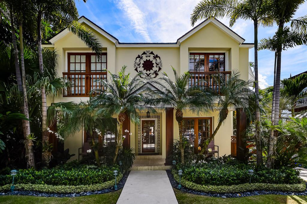 This charming Seaspray Avenue residence offers 2,754 +/- total square feet with 4 bedrooms, 4 full baths, 1 half bath, and a pool.   Ideally located in town close to the schools, restaurants, shopping, the Lake Trail, and the beach.  The living room has a fireplace, and French doors to the front and back terraces.  The updated kitchen has new cabinetry, stainless steel appliances, a gas range, and opens to the outdoor terrace overlooking the pool.   In addition to the main residence, there is a two-story guest house with a living room and half bath downstairs, and a bedroom and full bath upstairs.