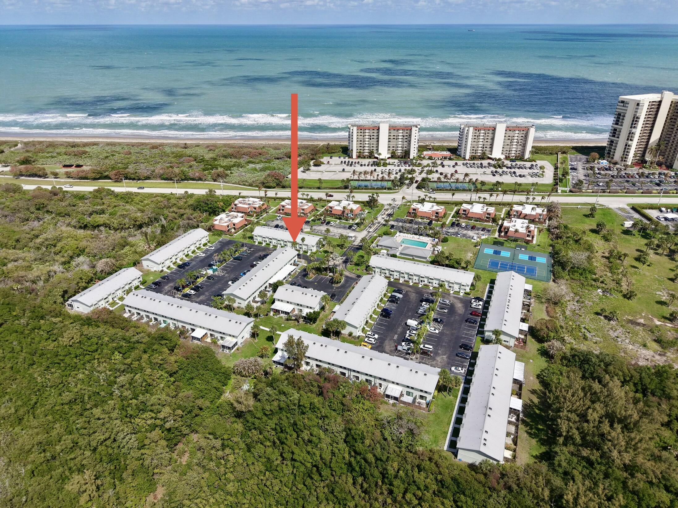 Experience refined coastal living in this beautifully updated 2-bed,1.5-bath townhome on sought-after Hutchinson Island, just steps from the beach with serene lagoon views. The residence features a newly renovated kitchen with granite countertops, stainless steel appliances, wood and tile flooring, luxury plantation shutters & stylishly updated bathrooms. Recent improvements include a 2023 metal roof, new AC, and fully replaced plumbing, offering peace of mind. Enjoy an expansive outdoor patio perfect for relaxing or entertaining, along with a 140-inch movie screen with projector and additional storage space. This vibrant community offers a newly renovated clubhouse, pool, library, event space, tennis, pickleball, and private beach access. Walk to the beach and nearby coastal restaurants. FULL STORM PROTECTION ! ACCORDIAN SHUTTERS! HOA includes exterior insurance, requiring only an HO6 policy for owners. No special assessments. Leasing is allowed after one year of ownership with a 30-day minimum rental term. HOA dues cover cable TV, high-speed internet, private beach access, water and sewer, trash, lawn care, landscaping, tree trimming, fence repairs, exterior faucets and lighting, pavement maintenance, and pool and clubhouse amenities.