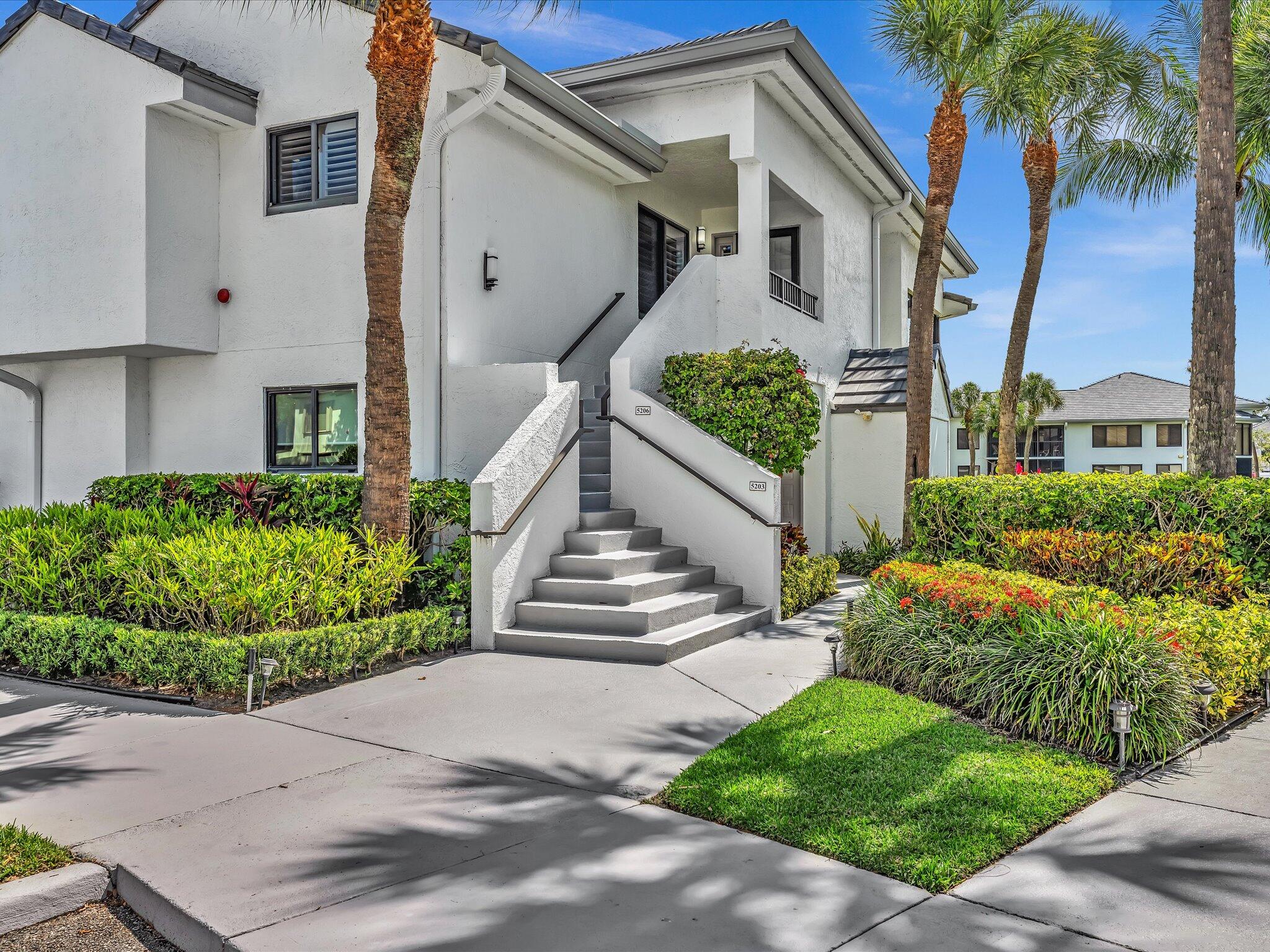 Move right into this beautiful second floor Bobby Jones Condo, flooded with light and serene views. This turnkey, fully furnished home, has vaulted ceilings in the living room, den and primary suite and unobstructed views of the lake and fountain. The updated kitchen includes gleaming white cabinets, updated appliances, granite counters and a windowed eating area. The updated primary suite includes an oversized bath with a designer double vanity, upgraded walk-in shower and custom closet. The guest bedroom and main bath are also updated.  Other special features include tasteful, neutral décor, impact windows throughout, custom lighting and closets, wood flooring, plantation shutters, 80" television in the living room and so much more...  Purchase by Sept15th &take advantage lower club fee Purchase by Sept 15th and save on the Country Club Membership