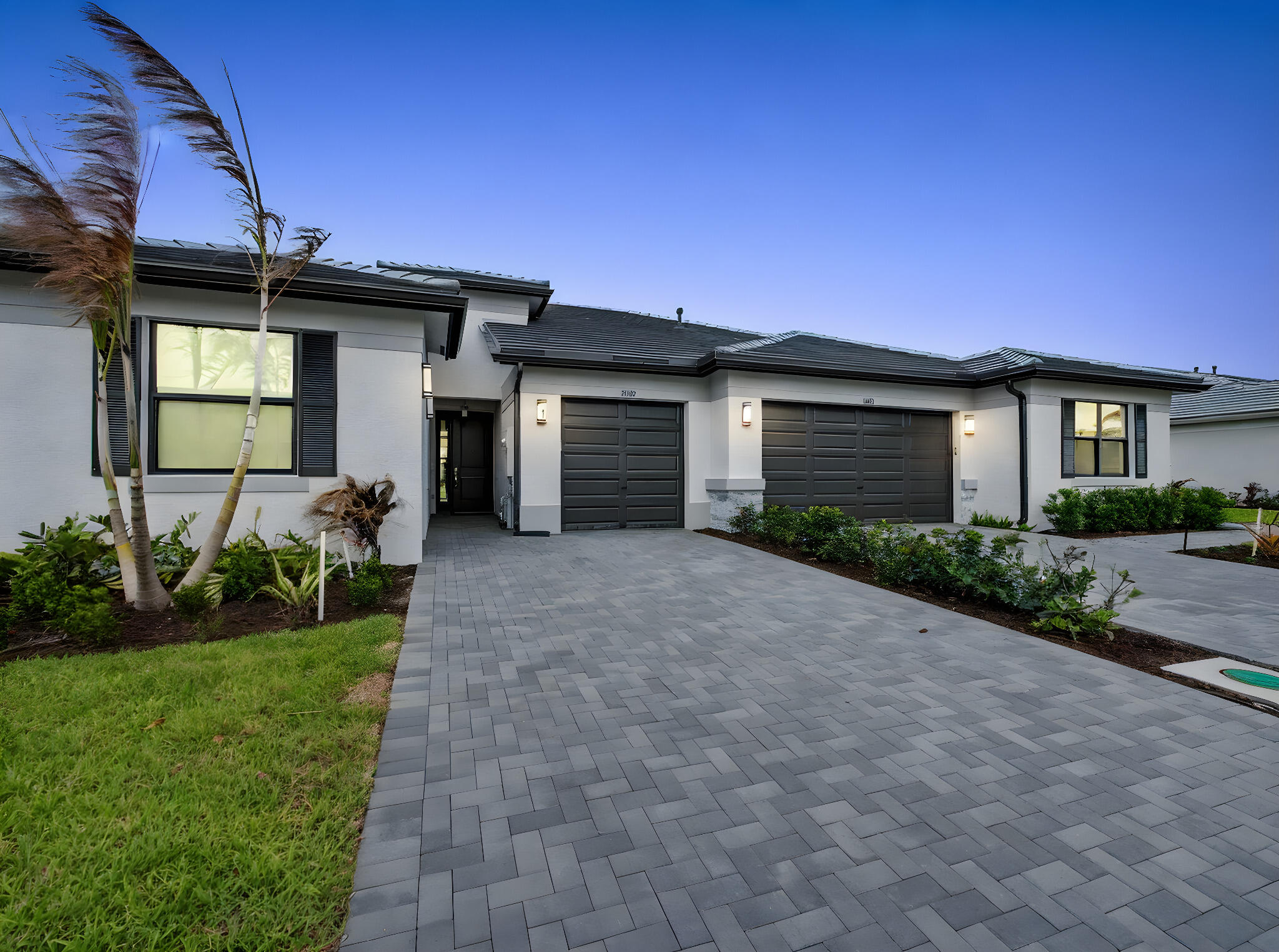 Valencia Parc at Riverland is where you'll find Port St. Lucie's best 55+ lifestyle with a million ways to have fun including a beautiful 38,000-square foot Clubhouse with resort-style amenities. This Areca floorplan includes private views and an open floor plan with matte tile flooring throughout the entire home. The home features high end finishes including impact glass windows, GE gas appliances, tile roof, and recessed LED lighting.  The kitchen includes quartz countertop with a designer marble tile backsplash, painted bright white maple cabinets, and GE stainless-steel appliances with a chimney hood. All bathrooms include high end quartz countertops and painted bright white maple vanity cabinets. Includes upgraded decorative lighting and window treatments worth over $15,000. Valencia Parc offers access to the amazing facilities found throughout the 4,000 acres of master-planned amenities at Riverland, where bigger is better! Stay fit at the 24-acre Sports & Racquet Club that offers over 80 outdoor sports courts and a 51,000 square-foot Wellness & Fitness Center. At Riverland you'll also find ways to express yourself at the 5-acre Arts & Culture Center, a bustling Town Center, the 12-acre Paseo Park among many future city parks and much, much more! You'll be able to easily access it all with the 5 miles of gorgeously landscaped traffic-free Paseo and greenways that connects everyone and everything throughout Riverland like never before - all that's missing is you! CONTACT FOR MORE DETAILS AND TO SCHEDULE TIME TO PREVIEW.  Includes a premium $15,000 upgrade package featuring designer window treatments and a custom lighting package, offered at no additional cost to the purchaser,