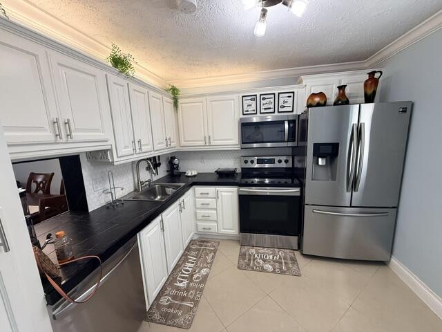 Beautifully updated first-floor 2 bedroom, 2 bath condo in the desirable 55+ community of Village Royale on the Green. Spacious living and dining area, newer stainless steel appliances, remodeled bathrooms, brand new A/C June 2026, enclosed patio/bonus room overlooking green space. Enjoy convenient first-floor living and an active adult community with clubhouse, pool, fitness center and more. Close to beaches, shopping, dining, I-95, and all that Boynton Beach has to offer!