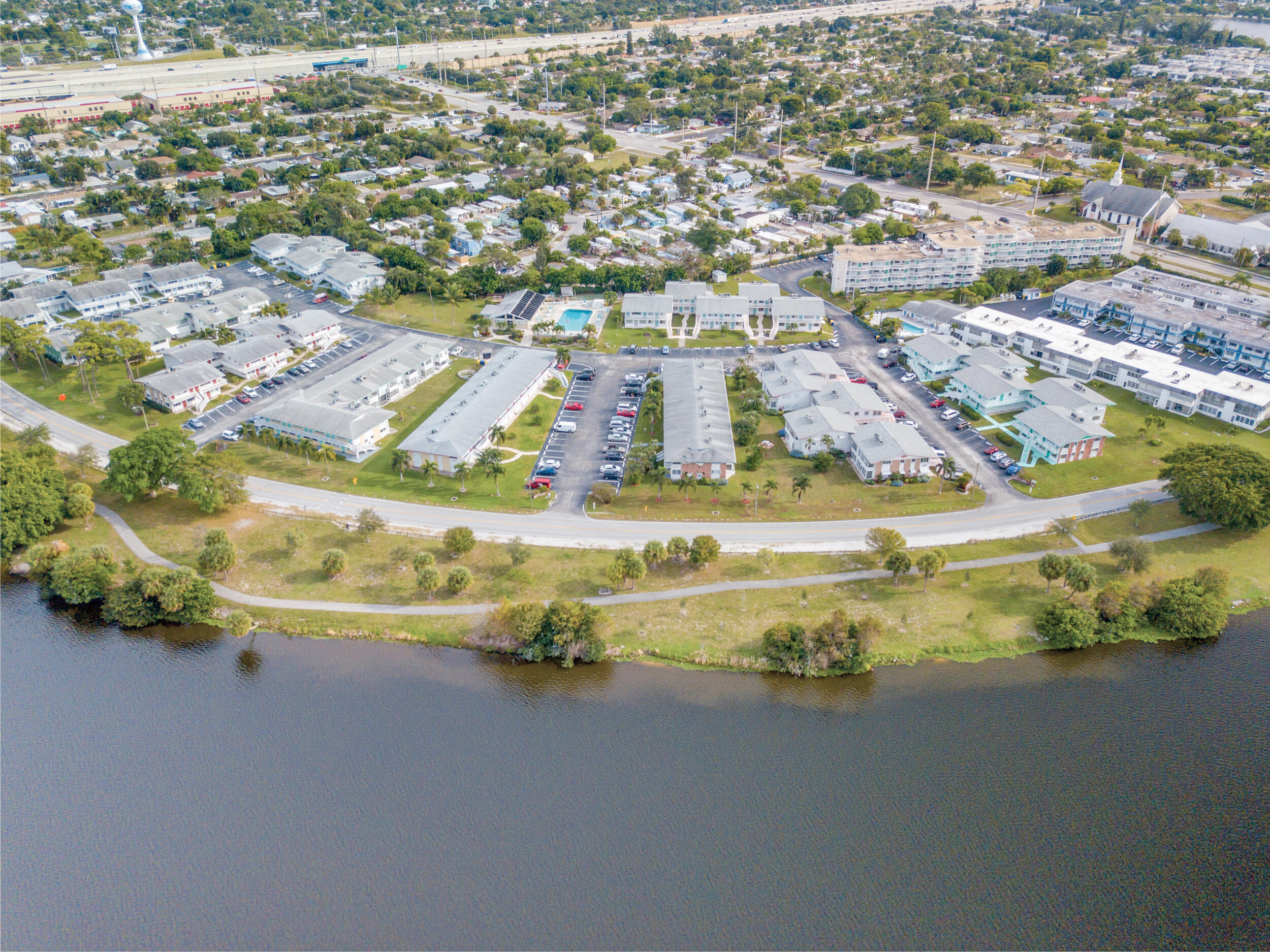Fabulous condo located close to the pool, features new bathroom vanity, AC, flooring, electric panel, water heater plus other upgrades.  A must see if you're in the market, wonderful Lake Osborne neighborhood.  Looking for a quick closing - furnished and ready to move in.