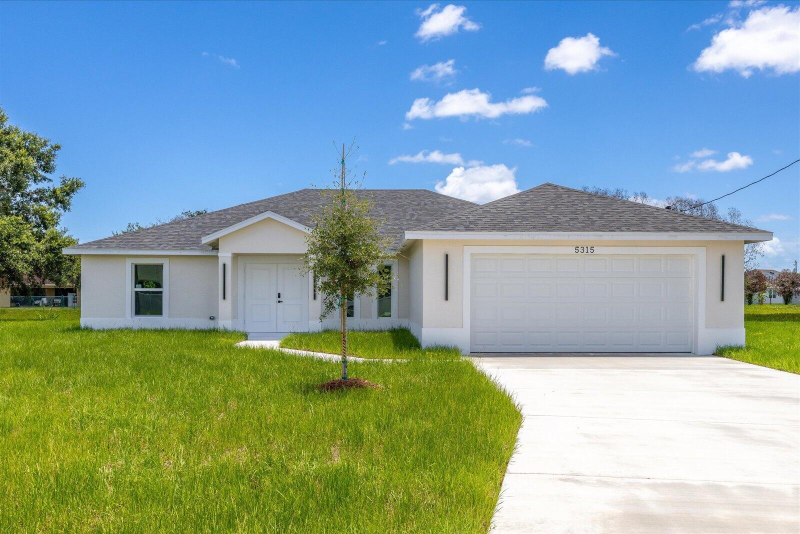 Welcome to this newly built single-family home, beautifully situated in a cul de sac street on a spacious 13 504 sqft lot (0.31 acre) with a peaceful backyard and plenty of room to add a future swimming pool. This stunning 4-bedroom, 2-bathroom residence combines modern design with everyday functionality. The open-concept layout features porcelain tile flooring throughout, impact windows, and a spacious kitchen with white cabinetry, under-cabinet lighting, quartz countertops, Samsung appliances, a pot filler above the range, and an oversized center island with a sink, glass rinser, and soap dispenser . The bright great room and dining area flow seamlessly to the patio, creating an ideal setting for indoor-outdoor living. This home offers comfort style and convenience in one beautifull home