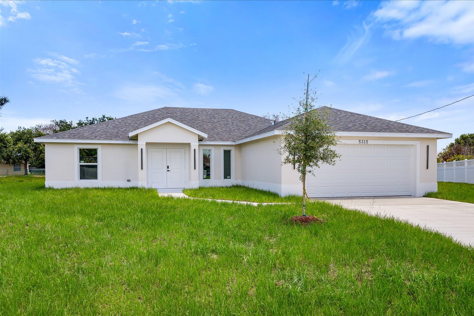 Welcome to this newly built single-family home, beautifully situated in a cul de sac street on a spacious 13 504 sqft lot (0.31 acre) with a peaceful backyard and plenty of room to add a future swimming pool. This stunning 4-bedroom, 2-bathroom residence combines modern design with everyday functionality. The open-concept layout features porcelain tile flooring throughout, impact windows, and a spacious kitchen with white cabinetry, under-cabinet lighting, quartz countertops, Samsung appliances, a pot filler above the range, and an oversized center island with a sink, glass rinser, and soap dispenser . The bright great room and dining area flow seamlessly to the patio, creating an ideal setting for indoor-outdoor living. This home offers comfort style and convenience in one beautifull home