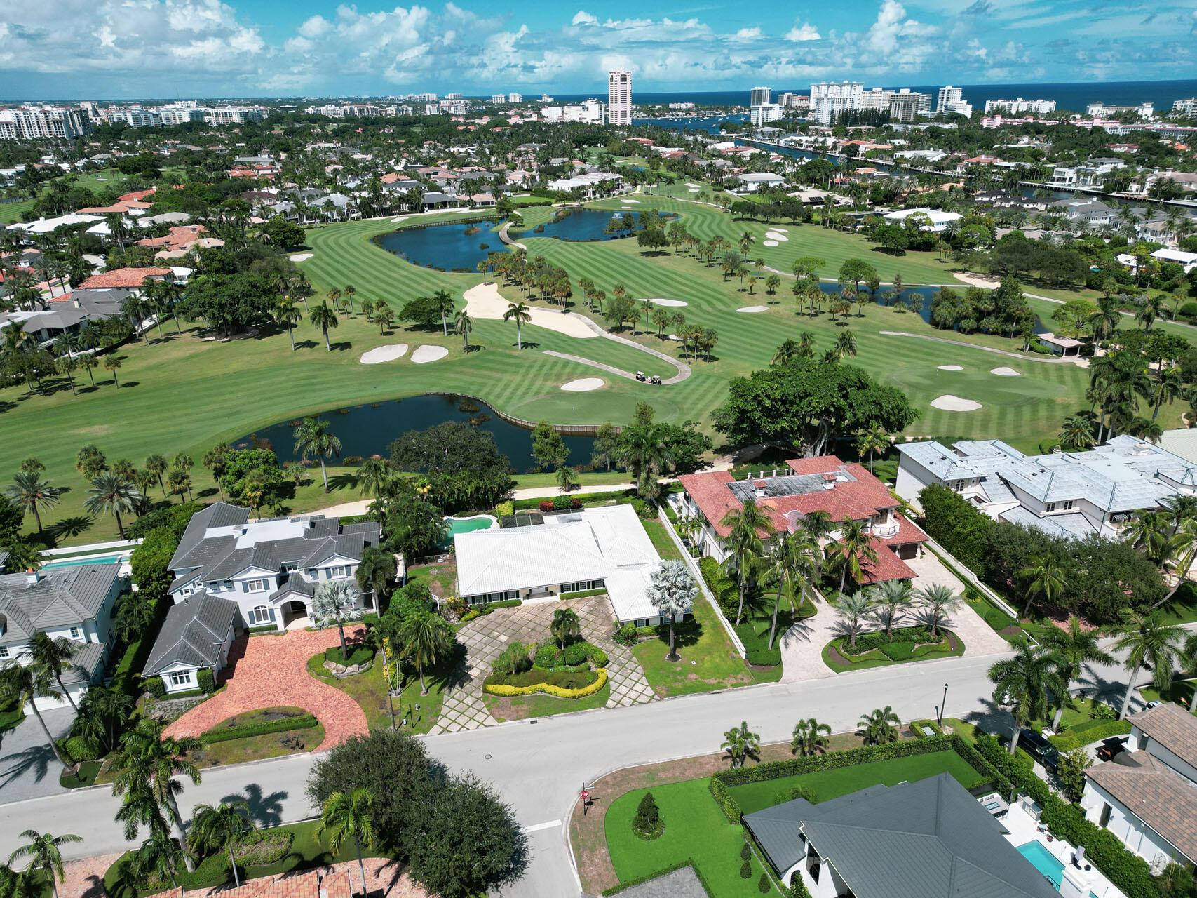 Golf course property with 130' of golf course frontage in Royal Palm Yacht & Country Club. Property being sold as-is.