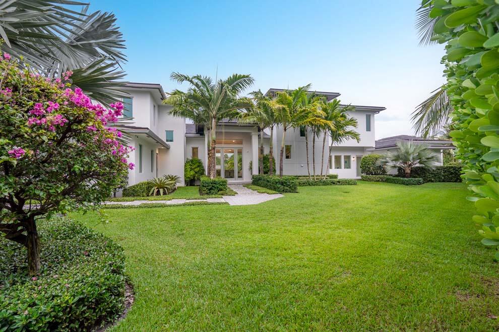 Designer estate with over 220 feet of waterfrontage, incredible views, protected dockage, and private beach access. Designed to perfection and situated on an elevated lot, the residence is offered turnkey, fully furnished. Features include six total bedrooms with first-floor master suite; VIP guest suite with kitchen; office/bedroom with full bath and three additional en suite guest rooms. Enjoy the covered loggia; summer kitchen; pool with overflow spa; and 50 foot dock with easy access to the ocean via nearby Inlet. Voluntary Homeowner's Association offers access to the private beach house with kitchen, showers; bathrooms and room for gatherings. Built in 2018, the current owner has added many designer and custom features. Enjoy waterfront living in this exquisite and private estate. FEATURES: 
" Over 220 feet of waterfrontage with protected dockage
" Stunning views of the manicured grounds and water
" Situated on almost one-half acre elevated lot 
" 5,395 square feet under air / 6,847 total square feet
" 6 total bedrooms; 6 full and 2 half bathrooms
" Offered turn-key, fully furnished
" Designer and custom finishes with additional high-quality upgrades made by current owner
o Custom fence enclosing the entire backyard with private gate for access to dock and Intracoastal Waterway
o Air conditioned three-car garage
o Two Tesla chargers installed 
o Large Generac underground generator and propane tank
o Complete security system with cameras throughout the property
o Aqualink to control the pool heater and all spa functions
o Custom electronic window treatments with blackout shades and sheers in every room
o Upgraded and largest capacity washer and dryer
o Custom installed dual system Wi-Fi 
o 60 inch Smart televisions, AV and Sonos speakers throughout the residence
o Completely renovated grounds for optimum privacy with custom landscaping and lighting
o Temper-Pedic beds in all bedrooms
o Custom, designer lighting
o Large dining table custom built for the space
" Volume ceilings, oversized windows, and sliders throughout offer abundant natural light
" Top-of-the-line appliances, countertops, hardware and flooring throughout
" Spacious interior rooms for residents and guests alike
" Modern kitchen with snack bar seating, pantry, and nearby powder room
" Living room and dining room provide access to large covered loggia
" First floor primary wing with private loggia; luxurious master bath; and large walk-in closet
" Two additional en suite first floor guest rooms
" North wing second floor VIP suite with private entrance, kitchenette, walk-in closet, and full bath
" Contemporary and dramatic stairway with all glass railings and impressive alcove for displaying a prized piece of art or baby grand piano 
" Second-floor office/bedroom with balcony, full bath and closet
" Additional second floor en suite guest room
" Covered loggia with summer kitchen and ample space for outdoor dining
" Sprawling pool terrace with room for outdoor living area and lounging poolside
" Heated pool with overflow spa feature
" 50 foot dock with easy ocean access via nearby inlet
" Expansive grounds with abundant privacy
" Decorative driveway and three-car air conditioned garage
" McCormick Mile residents are invited to join the voluntary Homeowner's Association which includes beach access with dune and use of the private beach house overlooking the ocean complete with kitchen, tables and chairs, showers, and bathrooms
" Town of Ocean Ridge is nestled along the central coastline of Palm Beach County with its pristine beaches, oceanfront parks, dedicated Town Hall, and private police department with patrol
This coastal waterfront estate is second to none with high-end finishes and upgrades. Come live the luxury life in this Ocean Ridge residence.
