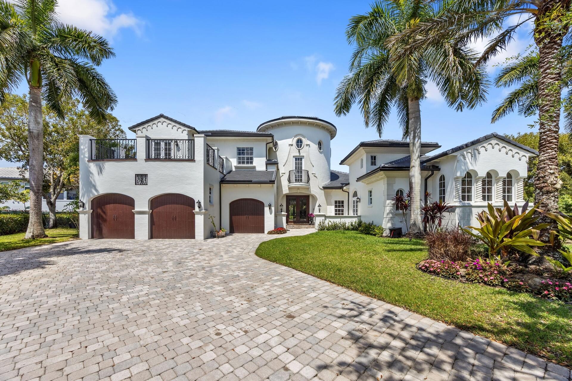 Now offered at $2,775,000, this exceptional waterfront estate home is nestled within the prestigious Heron Estates subdivision of Heron Bay, Parkland. Perfectly positioned on a private, oversized cul-de-sac lot, this exceptional residence offers a seamless blend of luxury, comfort, and sophisticated modern living. Boasting six generously sized bedrooms plus a dedicated office, the home provides abundant space for both refined living and effortless work-from-home flexibility. From the moment you enter, you are greeted by soaring ceilings, elegant travertine flooring throughout the main living areas, and rich wood flooring in the bedrooms—creating a warm yet elevated ambiance. Designed with both everyday living and entertaining in mind, the thoughtfully crafted floor plan features a formal dining room, a charming breakfast nook, and expansive living areas enhanced by custom woodwork and refined architectural details. At the heart of the home, the gourmet kitchen is a true showpiece—equipped with a Wolf gas cooktop, pot filler, dual Miele dishwashers, Sub-Zero Refrigerator and Freezer, and a built-in Miele coffee system in the Butlers Pantry, making the kitchen as functional as it is impressive. Entertain with ease at the full custom bar, complemented by a dedicated wine cellar for the ultimate hosting experience. The luxurious primary suite serves as a private retreat, complete with a serene sitting area, spa-inspired atmosphere, and a custom-designed walk-in closet. Step outside to experience the best of South Florida living. The backyard oasis features a heated saltwater pool, retractable patio screens, and peaceful waterfront views—perfect for relaxing or entertaining year-round. Additional highlights include a remote-controlled gas fireplace, central vacuum system, and full impact windows and doors. Significant recent upgrades include a new roof (2024), updated A/C units (2022-2023), and a new electric pool heater (2023). Residents of Heron Bay enjoy access to two resort-style clubhouses—The Commons and Plaza Del Lago—offering a wide array of amenities. From state-of-the-art fitness centers and social spaces to tennis, pickleball, and a waterpark, there is something for everyone. Both clubhouses also feature locker rooms and are conveniently accessible by foot, bike, car, or golf cart.