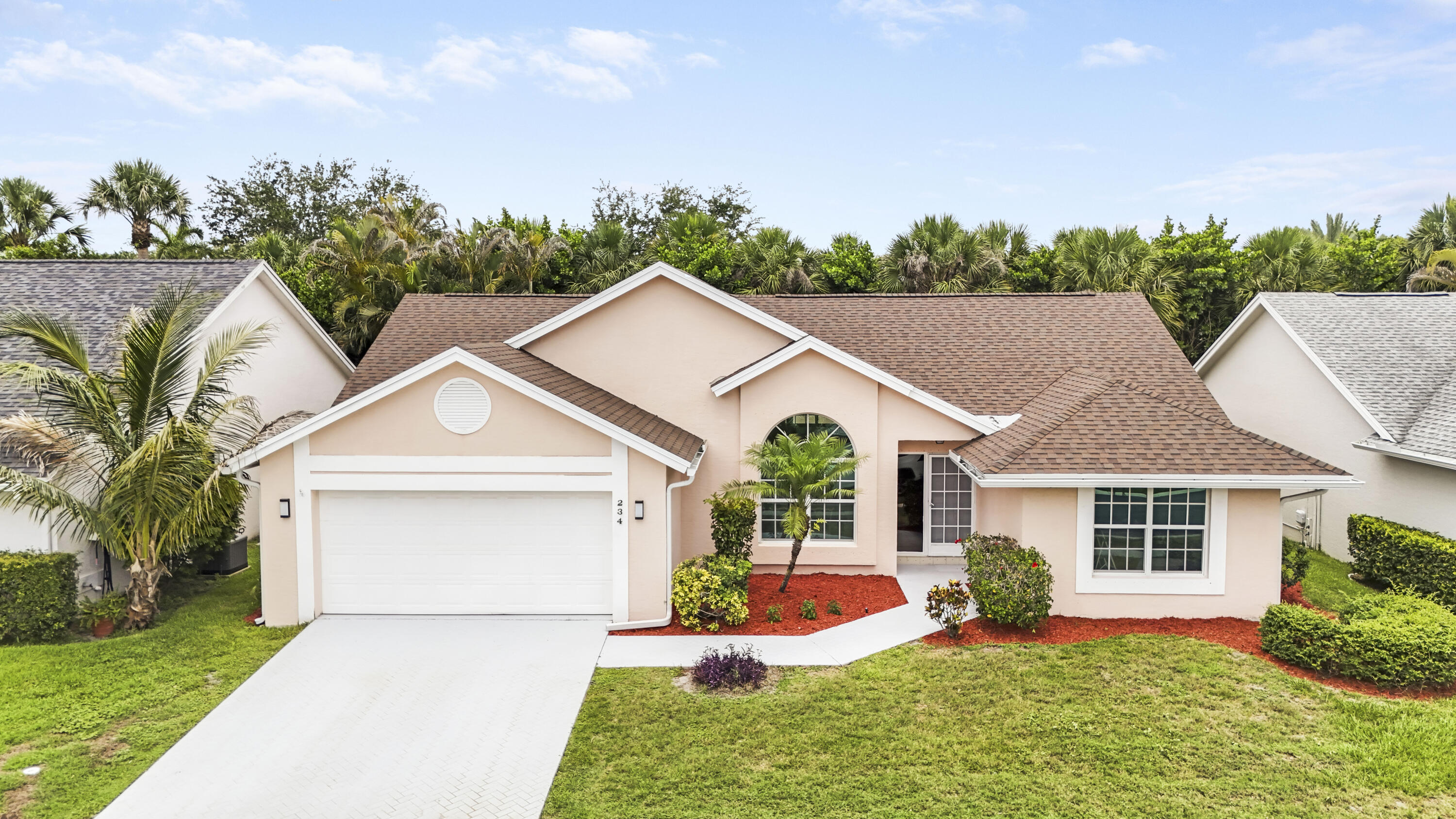 Fantastic opportunity to own a piece of paradise! Welcome to Jupiter. Located in the desirable Eagle Ridge community of Indian Creek, this 3-bedroom, 2-bathroom home with a 2-car garage plus a versatile den/office/playroom offers over 1,600 square feet of living space under air, complete with vaulted ceilings and abundant natural light. Built with solid CBS construction for added peace of mind, the home also features a new roof and gutters (2025), new electrical panel (2023), newer HVAC system (2021), water heater (2021), high-capacity washer and dryer, and impact glass windows throughout.  Freshly painted and move-in ready, the split floor plan includes a spacious primary suite and a large eat-in kitchen with stainless steel appliances (microwave 2025, range 2023) and granite countertops.  In the back of the home, you will find a covered screened patio and an additional open private patio area, perfect for relaxing or entertaining and ideal for the Florida lifestyle. The property is located within a lovely golf course community with no mandatory membership and low HOA fees that include common areas maintenance, landscaping, basic cable, and pest control. The community (heated) pool is conveniently located just down the street and the golf club restaurant is open to the public. Ideally situated in a central Jupiter location, this home is zoned for A-rated schools and is just minutes from I-95 and the Turnpike, shopping, dining, Roger Dean Chevrolet stadium, pristine beaches, and only 20 minutes from Palm Beach International airport. Schedule your private showing today!