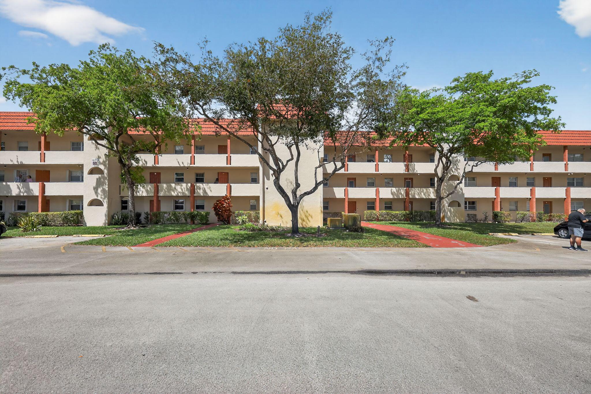 CRISP, CLEAN, & FULLY FURNISHED! Step into this beautifully maintained, move-in-ready retreat in the heart of the premier 55+ Sunrise Lakes Phase 3. This 3rd-floor gem is freshly painted and features modern laminate flooring throughout for a sleek, seamless look. The open-concept living and dining area is bathed in abundant natural light flowing in from the enclosed patio room, where you can enjoy serene, picturesque views. The chef-inspired kitchen is both functional and stylish, boasting granite countertops, clean white appliances, a double sink, and plenty of cabinet space. Retreat to the oversized master suite, which features a private ensuite bath and ample closet space. Upgraded paddle fans throughout ensure comfort year-round. Living in Sunrise Lakes Phase 3 is like being on a permanent vacation! Your lifestyle includes access to a massive clubhouse, professional fitness center, billiard room, theater, and multiple heated pools. Enjoy the private 9-hole golf course, tennis, and pickleball courts. Conveniently located near world-class shopping at Sawgrass Mills, dining, and major highways. With separate laundry facilities on-site and a turnkey setup, this unit is a must-see at this price. It won't last—schedule your showing today!
