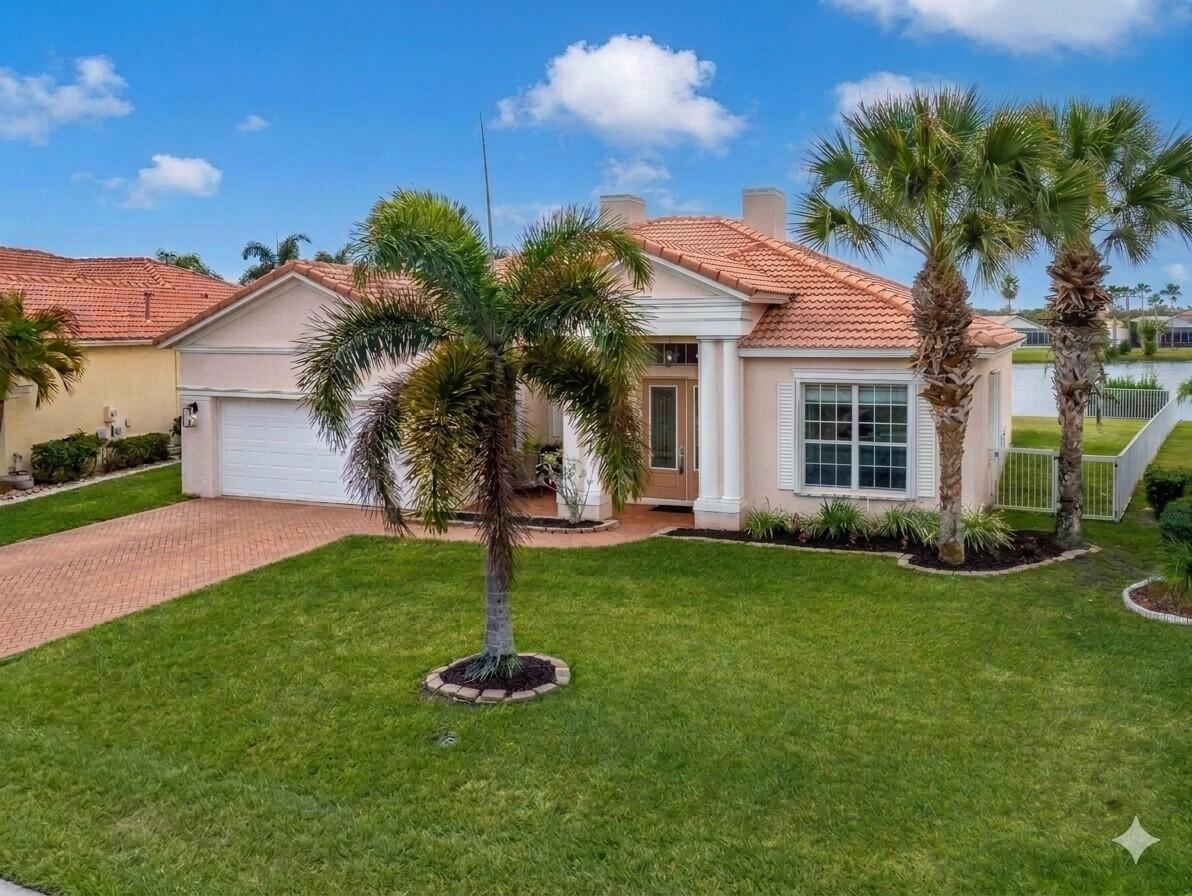 Elegant lakefront 3BR/2BA/2CG + den home in sought-after Lake Forest. Bright, open layout with inviting foyer, crown molding, and separate living and family rooms. Updated kitchen features quartz countertops, 42" wood cabinetry, stainless appliances, and walk-in pantry. Private den with French doors offers flexible space. Spacious primary suite with tray ceiling. Newer HVAC, accordion hurricane shutters, and whole-house generator. Enjoy tranquil lake views from screened lanai and fenced yard. HOA includes lawn care, cable, internet, pools, fitness center. Minutes to St. Lucie West shopping, dining, and I 95 — waterfront living at its best! Please note: First two pictures, AI used to enhance colors.