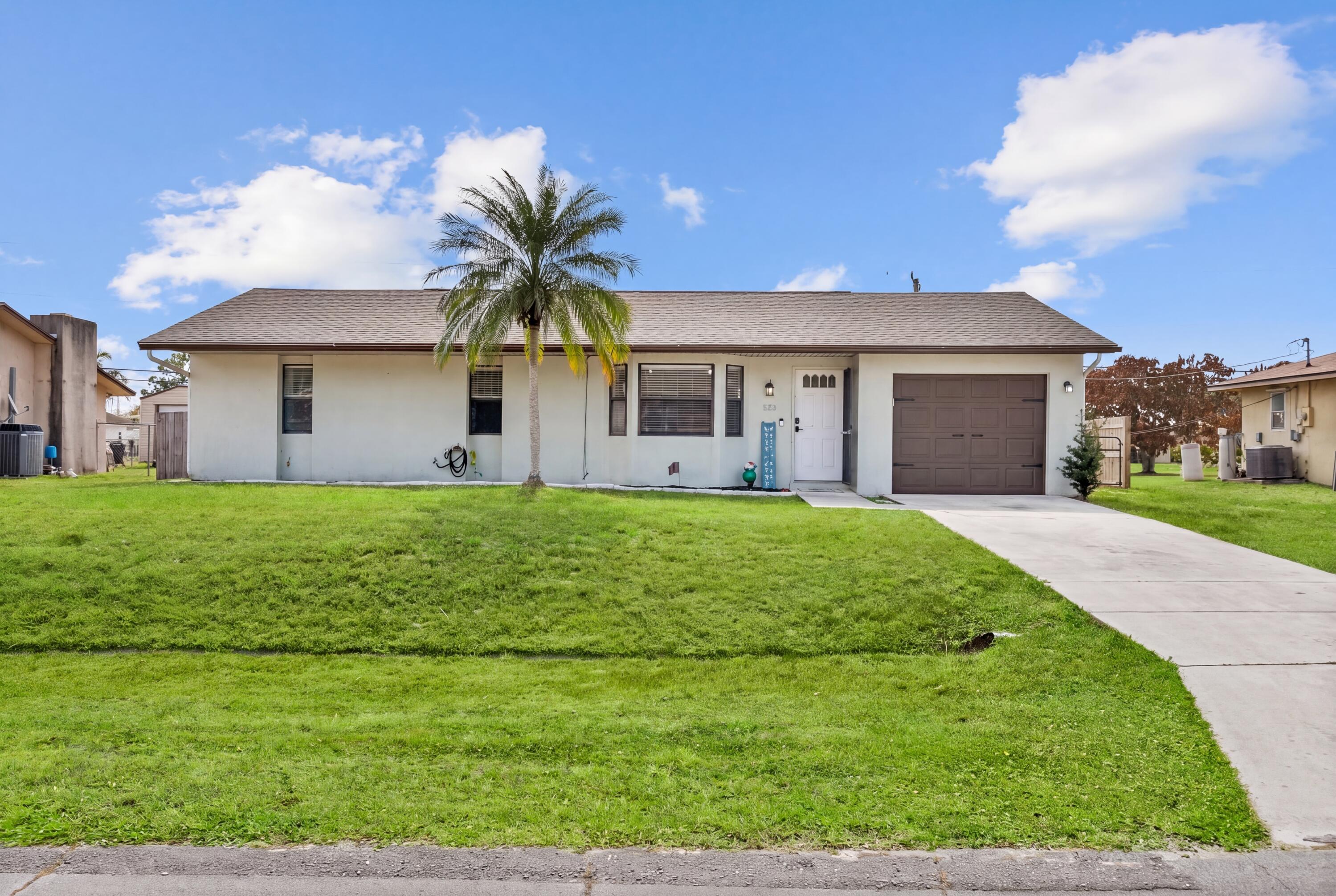 Move in ready, NEW ROOF, Motivated seller! This 3 bed, 2 bath, 1 car garage home features vaulted ceilings, new LVP flooring in the main living areas, and a 2025 roof. The kitchen features updated appliances and master bathroom has also recently been updated. Enjoy a covered patio overlooking a large, fully fenced backyard with plenty of room for a pool or outdoor entertaining. Conveniently located near shopping, dining, I-95, and nearby parks including Oak Hammock Park and Jessica Clinton Park, plus a short drive to beaches and waterfront attractions along the Treasure Coast. Go east to the beach or west to Traditions all under 15 min.