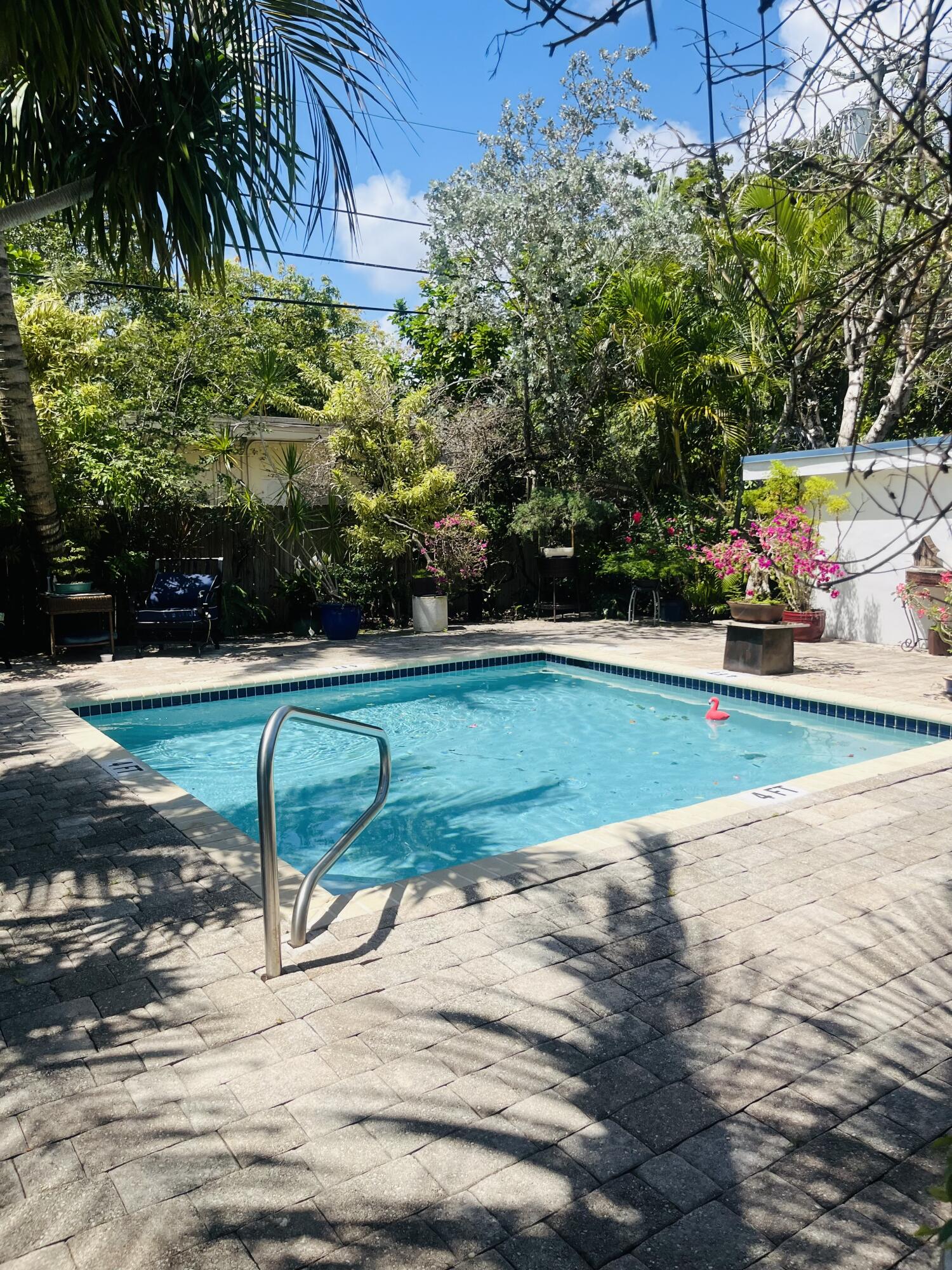 Freshly updated and move-in ready, this 1bedroom, 1bath residence features polished marble floors, new bedroom flooring, fresh paint, quartz countertops, stainless steel appliances, new blinds, and a new hot water heater. Additional highlights include a walk-in closet and private gated front yard.  Enjoy on-site laundry, a tropical pool area, and a pet-friendly community. Immediate rental eligibility makes this an excellent opportunity for both investors and owner occupants seeking flexibility and value.
