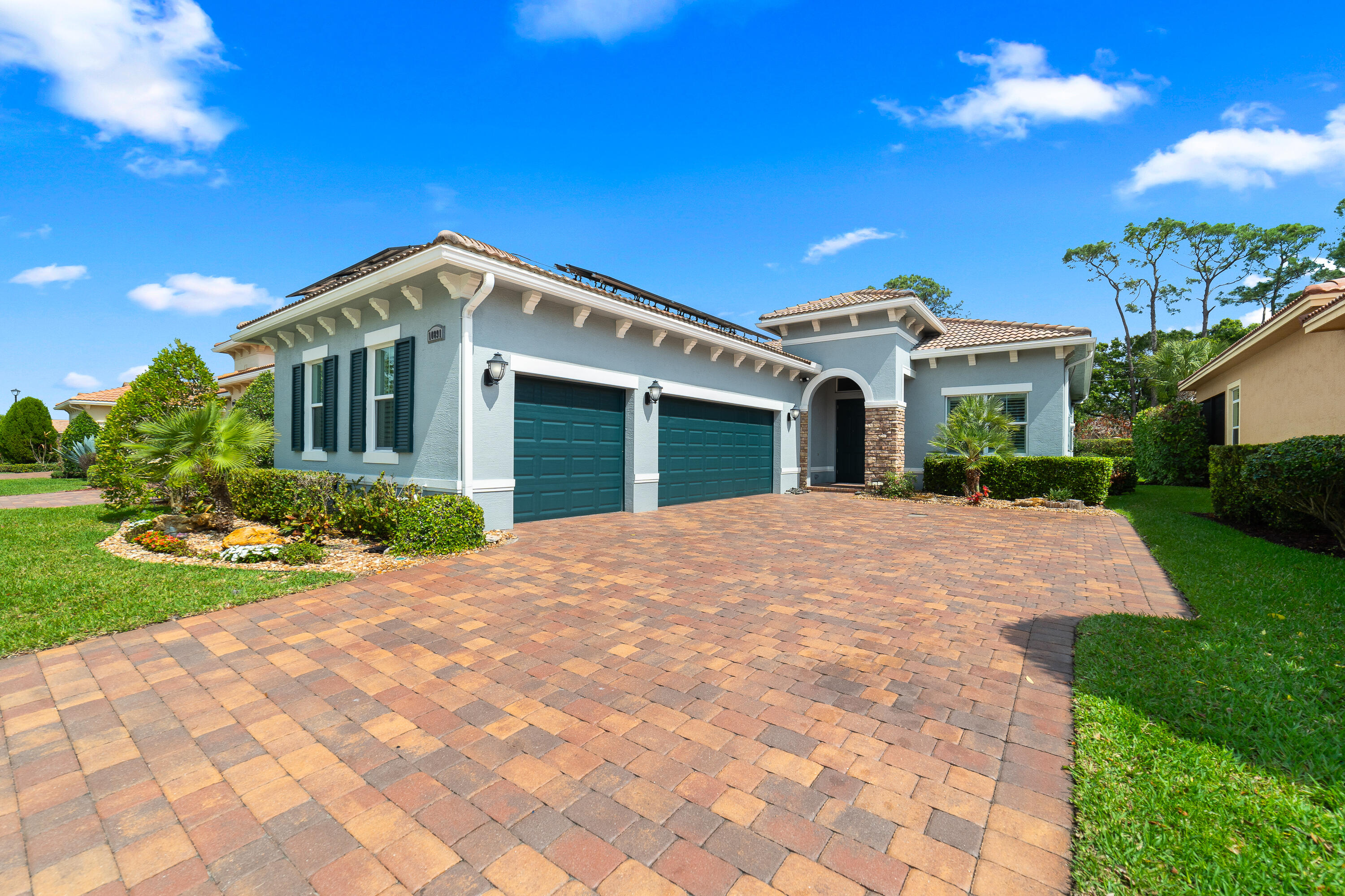 Experience the ultimate blend of luxury and resilience in this stunning 2015-built residence, featuring a sophisticated side-load 3-car garage and an interior defined by high-end finishes. The home makes a grand statement with soaring 8-foot doors, elegant crown molding, and sleek tile flooring that runs seamlessly throughout every room. At the heart of the home, the gourmet kitchen shines with premium granite countertops—perfect for both everyday living and upscale entertaining. Designed for efficiency and peace of mind, this property is equipped with a whole-house generator (2020), propane gas system (2020), solar panels for reduced electric costs, a new A/C (2024), whole house water softening system, and water heater (2023).  The backyard offers a private retreat, fully fenced (2015) and backing to a wall for added seclusion. Located within an exclusive gated community, residents enjoy resort-style amenities including a pool, clubhouse, pickleball courts, and billiards room.