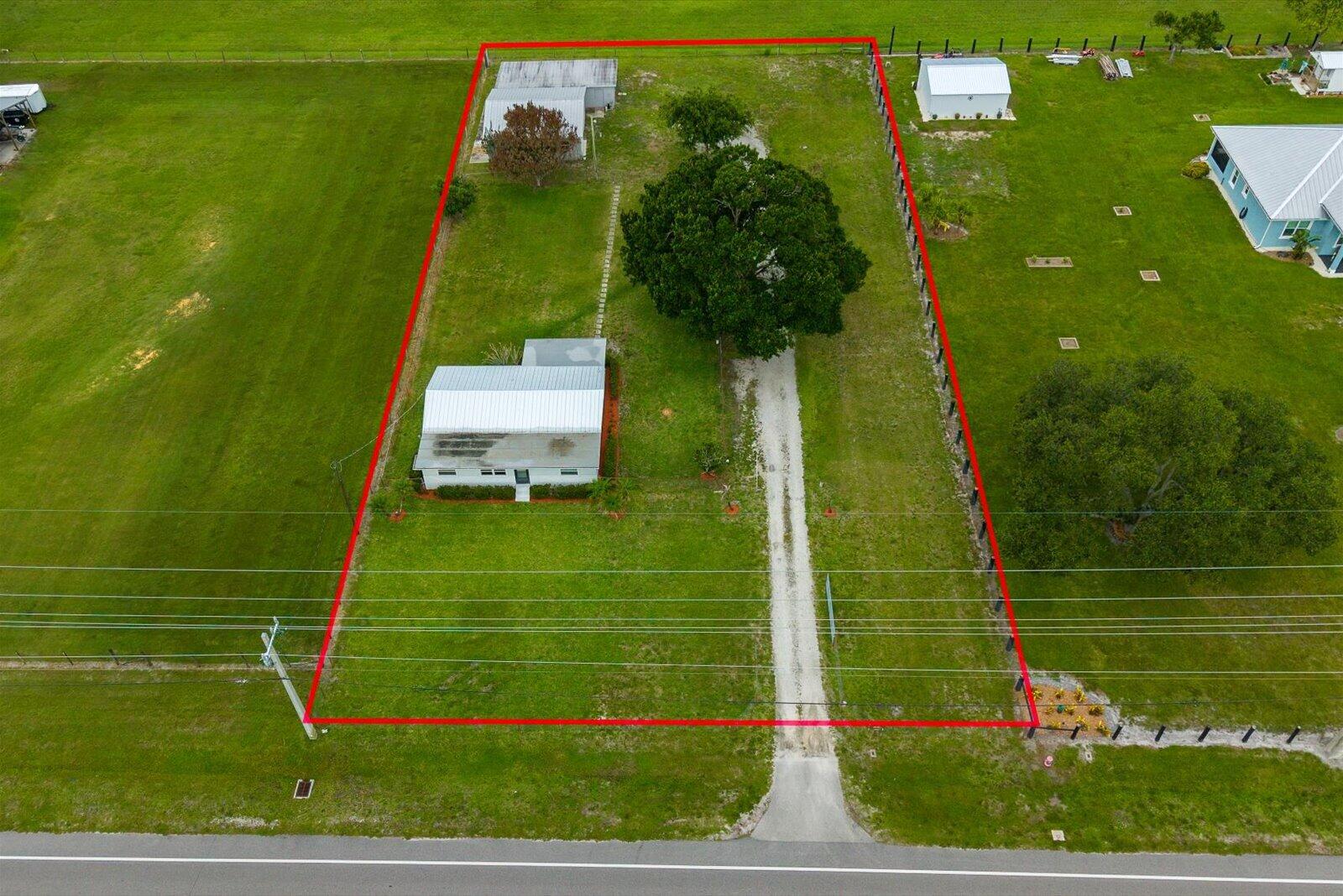 Offering 3.75% Rate** Recently renovated 3-bedroom, 2-bath home- JUST SHY OF 1 ACRE -in a desirable Vero Beach location, just minutes from the beach, shopping, dining, and everyday conveniences. Recent upgrades include a 2025 metal roof, all-new PEX plumbing, impact windows, and two new A/C systems. The updated kitchen features beautiful cherry cabinetry and stainless steel appliances. Situated on a fenced property, the standout feature is the impressive 60' x 57' barn/garage/workshop complete with an air-conditioned office or mother-in-law suite, plus a utility shed. Ideal for car enthusiasts, contractors, hobbyists, RV and boat owners, or anyone needing exceptional storage and workspace. Move-in ready with endless possibilities. NO HOA ***One or more photos are altered to remove item **