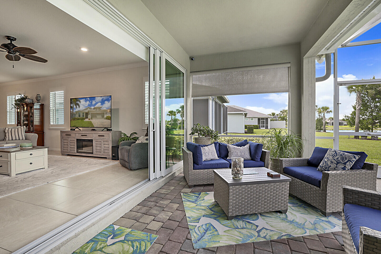 Located in desirable Phase 1 of Del Webb Tradition, this expanded Summerwood model offers a rare combination of upgraded features and resort-style outdoor living. The private heated saltwater pool, screened lanai, and mature landscaping create an inviting backyard retreat designed for year-round enjoyment.  Inside, you'll find over 2,000 sq ft of air-conditioned living space with 2 bedrooms, a versatile den, impact glass, natural gas cooking, and a bright open-concept layout ideal for everyday living and entertaining. The primary suite features an extended walk-in closet, while the garage includes a dedicated golf cart bay for added convenience and storage.  With nearly 4,000 sq ft total, this residence delivers exceptional indoor and outdoor living space while offering access to Del Webb