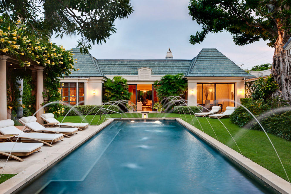 A sprawling and intriguing Bermuda graced by beautiful gardens and fountains.  On an oversized lot, it is well designed and proportioned  with downstairs master suite, library and gracious indoor/outdoor spaces ideal for entertaining.  Perfect for the art collector with a very special, one of a kind ambiance in the prime estate area convenient to all of Palm Beach.