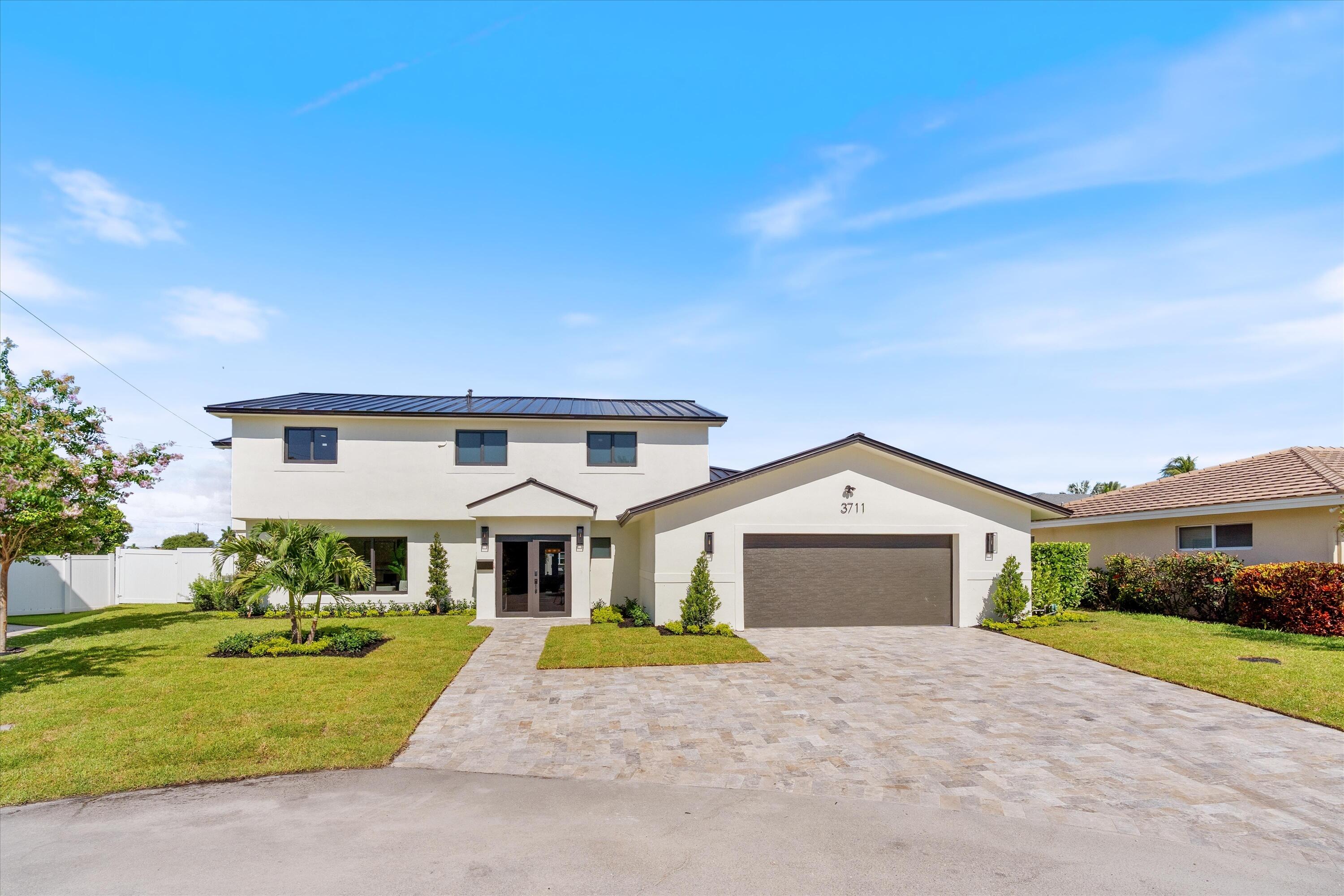 Completely rebuilt from the studs up, this exceptional waterfront residence delivers the quality and feel of new construction in one of Lighthouse Point's premier boating locations. Just under 3,000 square feet of thoughtfully designed living space has been transformed with every finish and system completely updated. Set on 110 feet of waterfront just off the South Grand Canal, the location offers a rare turnaround basin, making it easy to dock and maneuver larger boats. A standing seam metal roof and impact windows and doors complement the home's extensive renovation. Tucked away at the end of a quiet cul-de-sac, this rare turnkey residence offers exceptional waterfront living in Lighthouse Point just minutes from the Hillsboro Inlet and ocean.