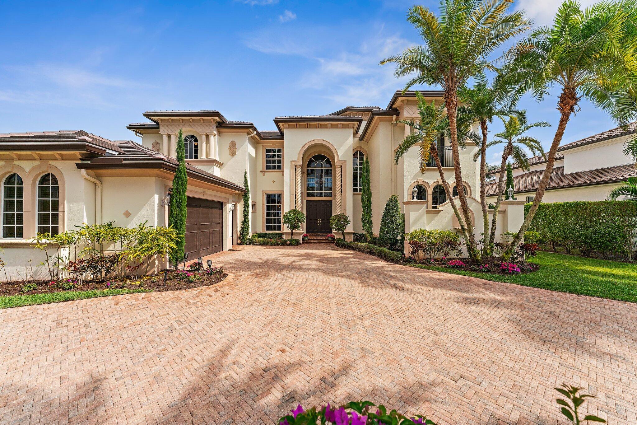 This is a rare opportunity to acquire one of Frenchman's Reserve's finest addresses and make it your own. Experience the premier Frenchman's Reserve lifestyle in this coveted Villa Rosa estate, situated just a block away from the Club in the heart of Palm Beach Gardens. Set on an exceptional lot with unrivaled lake and Arnold Palmer championship golf course views, this home offers a brand-new roof (2025) and is an extraordinary opportunity to personalize a luxury residence in one of the area's most exclusive country club communities. From the moment you open the double doors, soaring 24' ceilings and a wall of floor-to-ceiling windows fill the home with natural light and showcase stunning views of the tranquil lake and golf course. This luxury residence offers 5 bedrooms, 5 full bathrooms, 2 half bathrooms, a spacious loft, a separate library, and a dedicated home theater/movie room. The kitchen flows seamlessly into the family room and casual dining area, creating an open-concept space perfect for entertaining. A wet bar with bar seating completes the formal living and dining room entertaining areas. The elegant loft overlooks the main living room, adding openness and architectural drama to the heart of the home. The primary suite features the same breathtaking golf, water and pool views, his-and-hers walk-in closets with custom built-ins, and an adjoining room that can serve as a gym, office, or dressing area, with dual bathrooms for ultimate convenience. First floor also includes a private guest bedroom with ensuite bath and 2 half baths. Upstairs, four gracious guest suites provide private retreats, including a secondary primary suite with a private balcony, walk-in closet, and an oversized spa bathroom. A circular driveway and 2-car + golf cart garage provide both striking curb appeal and functional convenience. EV charger ready! Outdoor living includes a heated pool, spa, and expansive gated patio for year-round enjoyment. This home is more than a residence-it's a lifestyle. Residents of Frenchman's Reserve enjoy world-class amenities including golf, tennis and pickleball courts, a state-of-the-art fitness center, resort-style clubhouse with fabulous dining options and a Kids Club. A social/sports membership is required, with the option to join the golf exchange program for additional golfing privileges.