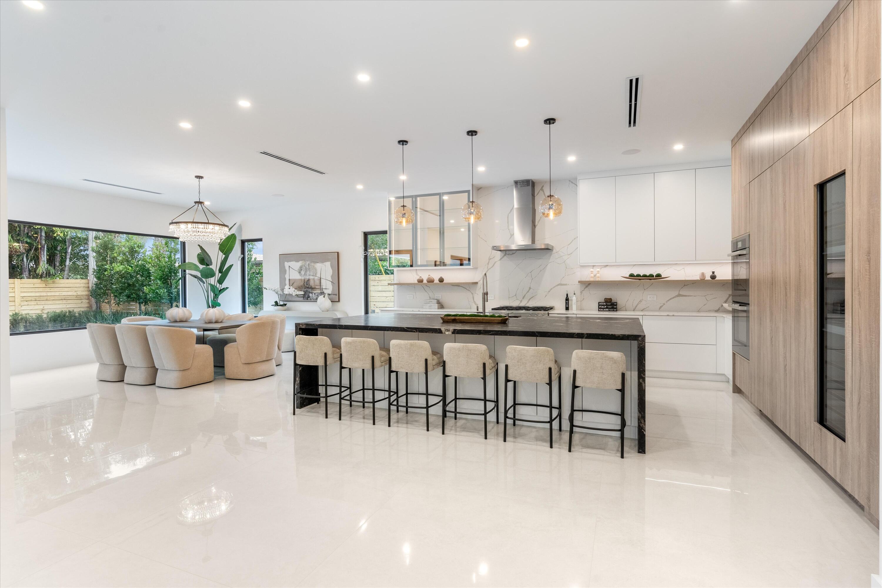SOPHISTICATED residence with warm neutral palette. Elegant yet cozy with refined finishes, classic but modern, with a touch of detail to pique your interest. The open-concept design offers a wonderful sense of space and flow, perfect for both intimate evenings and large family gatherings. Sophistication extends beyond the interior to the indoor-outdoor living spaces including stunning heated pool with infinity edge spa, expansive tumbled-marble veranda, outdoor kitchen/grilling, low maintenance turf, wood fenced yard and privacy landscaping.  it is the feeling this home evokes that truly sets it apart. Peaceful. Comfortable. Sophisticated. A home that simply feels right the moment you arrive.