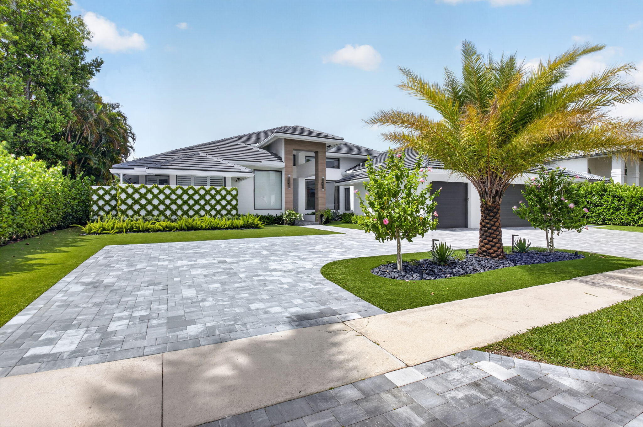 Completely renovated in 2024, this exceptional Woodfield Boca Raton residence blends  modern luxury with timeless sophistication. Offering 4,043 square feet of beautifully redesigned living space, the home features five spacious bedrooms and five-and-a-half elegantly appointed baths, thoughtfully crafted for both comfort and style. At the heart of the home is a stunning designer kitchen featuring dual islands, premium Wolf appliances, and a Sub-Zero refrigerator — creating a true chef's experience with top-tier performance, abundant workspace, and sleek contemporary finishes. Expansive living areas flow effortlessly for both everyday living and entertaining, while the meticulous renovation showcases elevated craftsmanship and attention to detail throughout.   The luxurious primary suite offers a spa-inspired bathroom featuring dual toilet rooms, double vanities, and an oversized walk-in shower designed for ultimate comfort and privacy. Additional highlights include an air-conditioned three-car garage, a brand-new roof, all impact windows for enhanced security and efficiency, and a fully integrated Control4 entertainment and smart home system for seamless modern living.  Step outside to a resort-style backyard designed for year-round enjoyment. The saltwater pool and hot tub features all new equipment, while the fully equipped summer kitchen elevates outdoor entertaining with a pizza oven, smoker barbecue, refrigerator, and built-in griddle — creating the ultimate setting for entertaining.  Located in one of Boca Raton's most desirable communities, this move-in-ready home delivers refined South Florida living at its finest.   • Effective November 2, 2026, the Full Equity Initiation Fee will increase by $75k, thereby bringing the Full Equity Initiation Fee from $180k to $255k.  o The Equity Contribution for Full Equity will remain at $45k. The total cost of a Full Equity Membership will go from $225k to $300k. • Effective November 2, 2026, the Standard Equity Initiation Fee will increase by $45k, thereby bringing the Standard Equity Initiation Fee from $132k to $177k.  The Equity Contribution for Standard Equity will remain at $38k. The total cost of a Standard Equity Membership will go from $170k to $215k.