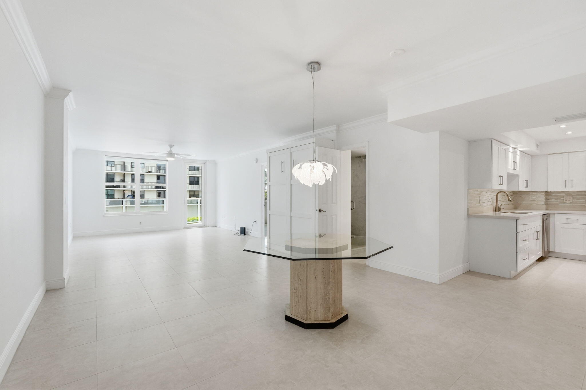 Renovated Unfurnished 1-Bedroom, 2 Full Bath Palm Beach oceanfront condo at 3450 S Ocean Blvd, Unit 121 offering 1,008 spacious square feet of coastal living. Beautifully updated with modern kitchen and finishes, open living and dining areas, and abundant natural light. Neutral porcelain tile floors run throughout, creating a clean and cohesive look. Generous primary suite with en-suite bath plus full guest bath. Washer/Dryer allowed. Complete impact glass throughout for storm protection and energy efficiency. Ideal for seasonal or full-time living. Inside, this spacious residence offers generous living and dining areas, a well-proportioned bedroom, and an updated kitchen and both full baths. Welcome to Apartment 121 at The Patrician, ideally positioned on the pristine sands of Palm Beach's sought-after oceanfront corridor. The Patrician offers the essentials that matter most: direct beach access, spectacular ocean views, and a prime location close to everything Palm Beach living is known for. Enjoy a recently replenished, wide beach just steps from your door and sweeping ocean views from the beautifully redesigned poolscape. The property features renewed balconies with modern glass railings, completed concrete restoration, updated hallways, covered pergolas, outdoor barbecue areas, a fitness center, and covered parking. The building is professionally managed by Campbell Management.The building's universal chiller system helps maintain lower electric costs, and building-provided hot water eliminates the need for an in-unit water heater. There is also the ability to add a washer/dryer within the unit. *No rentals First Year provided (20%) percent or more of the Units in the Condominium are not subject to a current and approved lease. Financing 30% down per association rules.  HOA is current 2026 amount.  The Patrician of Palm Beach Condominium Apartments is a nine-story, oceanfront residential building located at 3450 S Ocean Boulevard, Palm Beach, Florida. Completed in 1971, it houses 212 condominiums and serves as a prominent fixture along the town's South Ocean Boulevard corridor. Its extensive renovations and resort-style amenities make it one of the area's enduringly popular coastal properties.  Architecture and Setting Positioned between the Atlantic Ocean and the Intracoastal Waterway, the Patrician offers panoramic views in both directions. The reinforced-concrete structure features private balconies, impact-resistant windows, and newly modernized common areas, including a redesigned lobby and pool deck. Its location provides direct beach access and close proximity to the dining and shopping venues of Worth Avenue and South Palm Beach.  Amenities and Services The building provides full-service amenities typical of a luxury Palm Beach condominium: 24-hour door staff, on-site management, a heated oceanfront pool, fitness center, clubhouse, and community Wi-Fi. Residents also have access to covered parking, secure entry, a library, laundry facilities, and storage rooms. Outdoor features include grilling areas and cabanas along a newly expanded pool terrace.  Residences Units range from approximately 900 to 1,600 square feet, with one- to two-bedroom floor plans. Impact glass and modernized electrical and plumbing systems have been added throughout recent renovations, enhancing both comfort and hurricane resilience.  Community and Access Situated within the Palm Beach County attendance zone, the Patrician lies about 10 miles from Palm Beach International Airport and within minutes of major cultural attractions and golf courses. It reflects the area's blend of historic charm and contemporary coastal living, offering residents a combination of privacy, convenience, and seaside luxury.