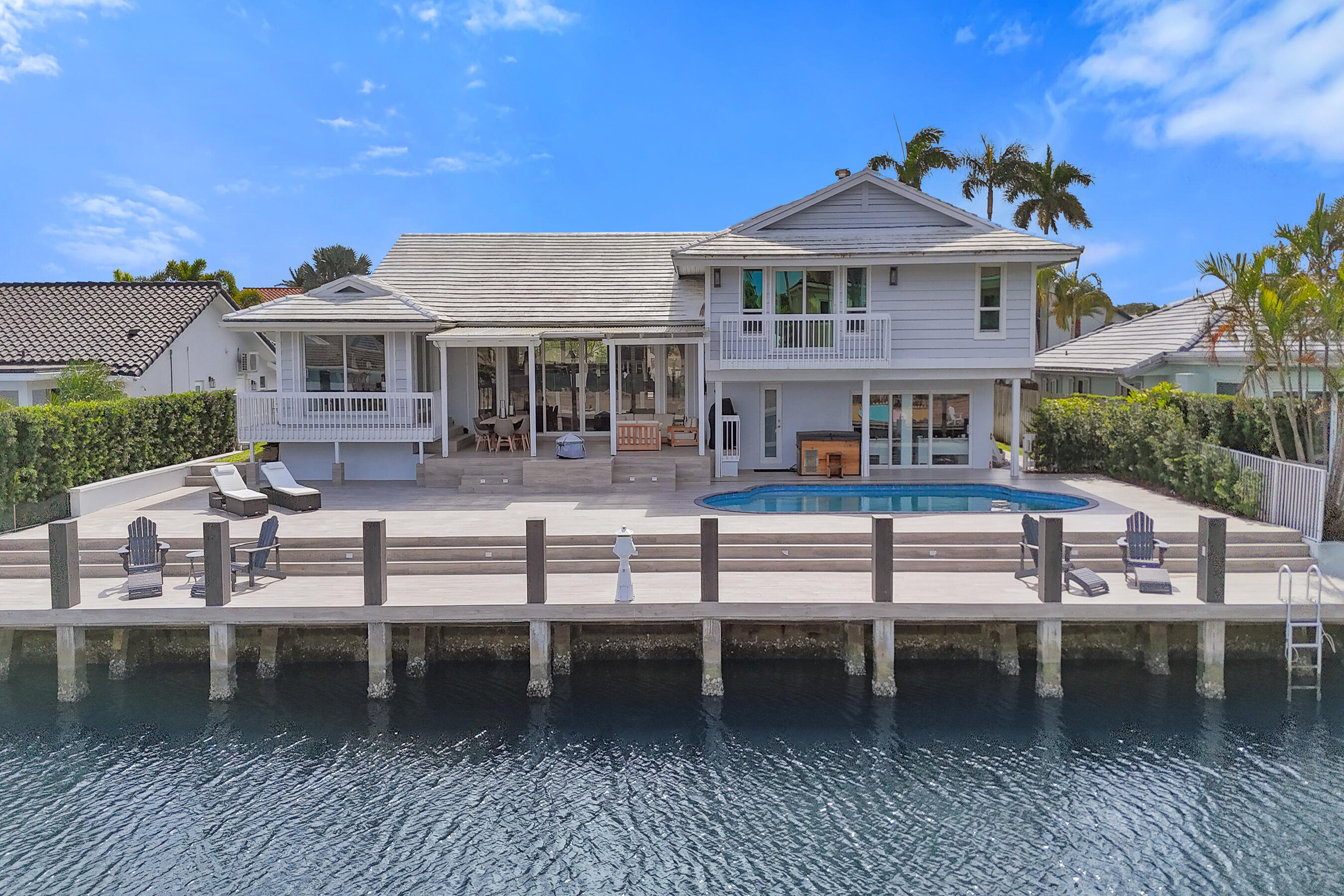 Welcome to 3001 NE 47th St in desirable Lighthouse Point. This 4-bedroom plus office, 4.5-bath single-family home offers 3,726 sqft of spacious living space, with a flexible layout ideal for everyday living and entertaining. The home presents a great opportunity for updates and personalization, allowing the next owner to design to their own stunning taste. Generous living areas,  perfect space for a mother-in-law suite or apartment, oversized bedrooms and strong structural layout provide an excellent foundation to create the perfect coastal residence. The primary suite impresses with two bathrooms and two walk in closets as well as a cozy fireplace.
The outdoor space recently has been thoughtfully designed, with a newly redone pool, patio and dock, ideal for entertaining and relaxing. With 85 linear feet on a deep water, ocean access canal, this property is every boat or yacht owner's dream. The Hillsboro Inlet is only a short distance away. The property is ideally located at the end of a quiet cul-de-sac street, near parks, playgrounds, tennis and pickleball courts, dining, and award-winning beaches. This beautiful waterfront home is optimal for buyers looking to add value and make this their own in one of Lighthouse Point's most sought-after waterfront neighborhoods.