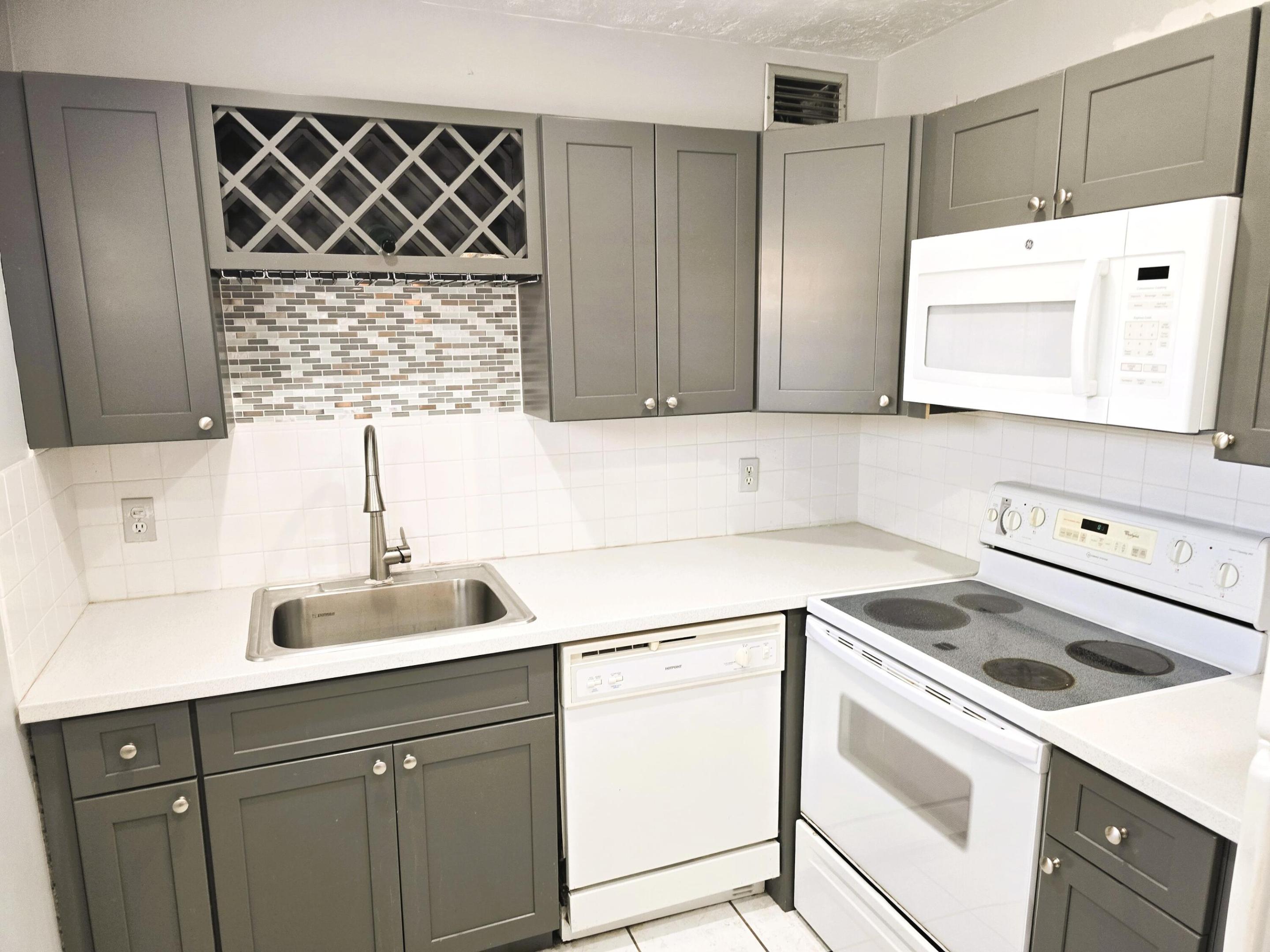 Gated Community , Find more to love in this beautifully updated condominium in desirable Kings Point . Elevator Access  . Spacious open-concept floorplan offers optimal flow with new paint, newer carpeting, and new flooring. Elegant, contemporary kitchen features Shaker-style custom cabinetry. Screened balcony offers a sheltered spot for additional seating. Enjoy the amenities of Kings Point including two 18-hole golf courses designed by Robert Trent Jones, Sr.; swim and tennis, and exercise studio. Beautiful state-of-the-art theatre with spectacular shows,  End Cafe and The Bistro. There's always something to do in this vibrant 55+ community, including entertainment, education, recreation, and social events. Manned gate, security features, and courtesy shuttle for your comfort an