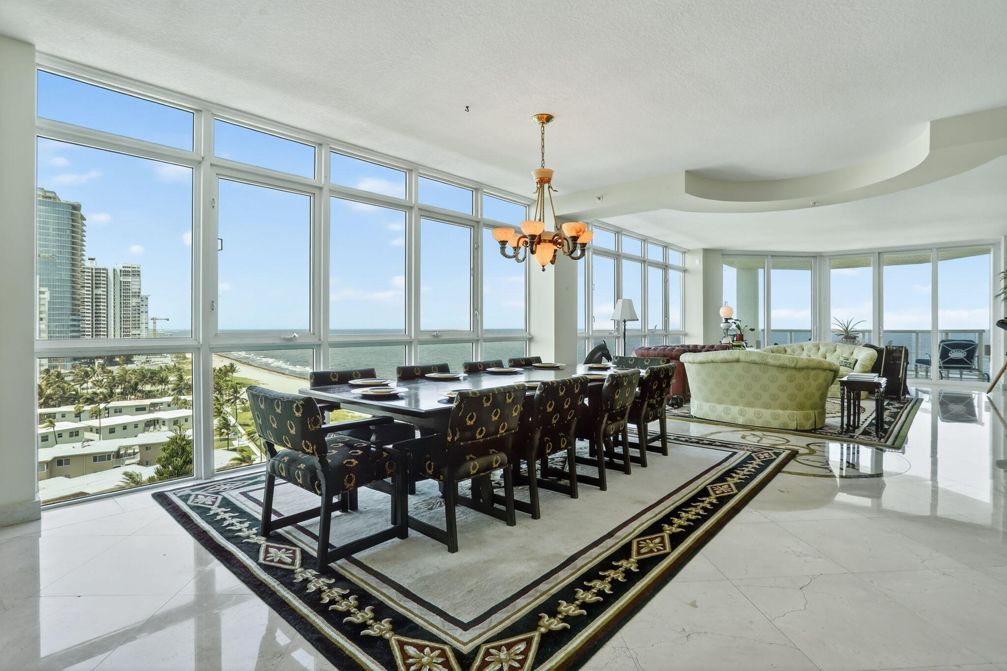 Rarely available Cristelle Cay condo--ready for a quick move-in! This prestigious building has only 25 condos. Enjoy 3,254 square feet under air living space, floor to ceiling impact windows and sliders, a semi-private elevator, both a deeded garage and carport space, 4 covered balconies, 3 storage rooms, and lots of natural light! This condo is 1/2 of the 10th floor! Walk in and see lots of wide water! Direct ocean and north exposures--and lovely marble flooring throughout. You have unobstructed views of the ocean, pool, beach, city skyline, and some Intracoastal views too! Black-outs in all 3 bedrooms--electric blinds in the primary bedroom. The primary has a large walk-in customized closet with His and Her sides. The 3rd bedroom faces the ocean and has a murphy bed. Exceptional value!