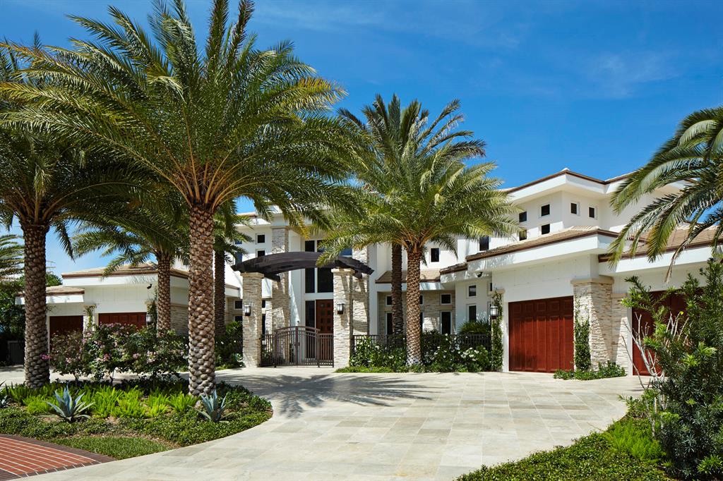 A featured cover story in Florida Design magazine, this magnificent contemporary custom-built home is the epitome of luxury. Ideally situated on one of the most scenic homesites, overlooking an expansive lake and with sweeping double-fairway golf course views, in exclusive St. Andrews Country Club. This impeccable 13,838 Sq. Ft. home was built in 2013 by an award-winning team. Architecturally designed to maximize the exceptional views of this property. This home features the finest materials and finishes available from around the world, including limestone floor tiles imported from France and exotic natural woods imported from Africa and South America. SEE MORE Intricate custom woodworking and architectural details are evident throughout the home, including stepped and coffered ceilings, Ledgestone-faced columns, rosewood panels, quartz and onyx countertops, solid alder wood doors with German hardware, and much, much more. Attention to every detail has been addressed and no expense was spared. Crestron home automation enables every facet of the home to be controlled via an iPad or iPhone including a closed circuit security system for inside and outside the home, thermostats, music, window treatments, lighting, etc. A full-house generator with two propane tanks, Subzero and Viking top-of-the-line appliances, Carrier intelligent air-conditioning central system, elevator, his and her separate two-car air-conditioned garages (four cars in total), two laundry rooms, Lutron lighting, temperature and water sensors for emergency cutoffs, a mosquito protection system, and a water filtration system, are just some of the amenities too numerous to list.

The floor plan of the multi-level 7-bedroom home is a modern wonder: expansive yet intimate, and designed to take advantage of the breathtaking panoramic lake and golf course views, with high ceilings all over the house and abundant exterior light. Floor-to-ceiling windows provide amazing vistas. Retractable glass doors open from the fully-outfitted gourmet kitchen, butler pantry, breakfast area, and large family room to a spectacular outdoor air-conditioned family room with a massive Viking barbecue with industrial-grade exhaust system, a bar island with teak wood, and a remote controlled fireplace. Phantom screens and accordion glass doors further open the home to the gorgeous backyard replete with an award winning glass-tiled infinity pool filled with ozone-purified water and an amazing multi-colored LED automated lighting system, marble pavers with laser-cut drains, automatic fire pits, and stunning lake and golf course views. A room-sized sauna and an outdoor shower lie adjacent to the pool area. Mature landscaping with specimen palms and tropical trees create an inviting and pleasant space.
The master suite has a separate private sitting room connected via custom alder wood doors to the master bedroom which boasts separate custom closets totaling a massive 600 sf, spectacularly-designed his and her bathrooms, and a hurricane/fire-proof safe room. The first floor guest wing features four sizable ensuite bedrooms.

Upstairs, the two ensuite guest bedrooms and playroom are flanked by an enormous covered terrace. A mini-kitchen, a second laundry room, an extra powder room, and two generous silverware storage rooms are conveniently located on this level. Another staircase provides privacy for a spacious custom-built office separated by German glass doors from a comfortable den with its own private bathroom and balcony with extravagant views.
Home is aproximately 10,700 sq ft under air wtih an additional 1,200 sq ft under screened porch, making the functional living space at 11,900 sq ft.

Superlative in every way, this home is a dream come true for the most sophisticated and demanding homeowner.